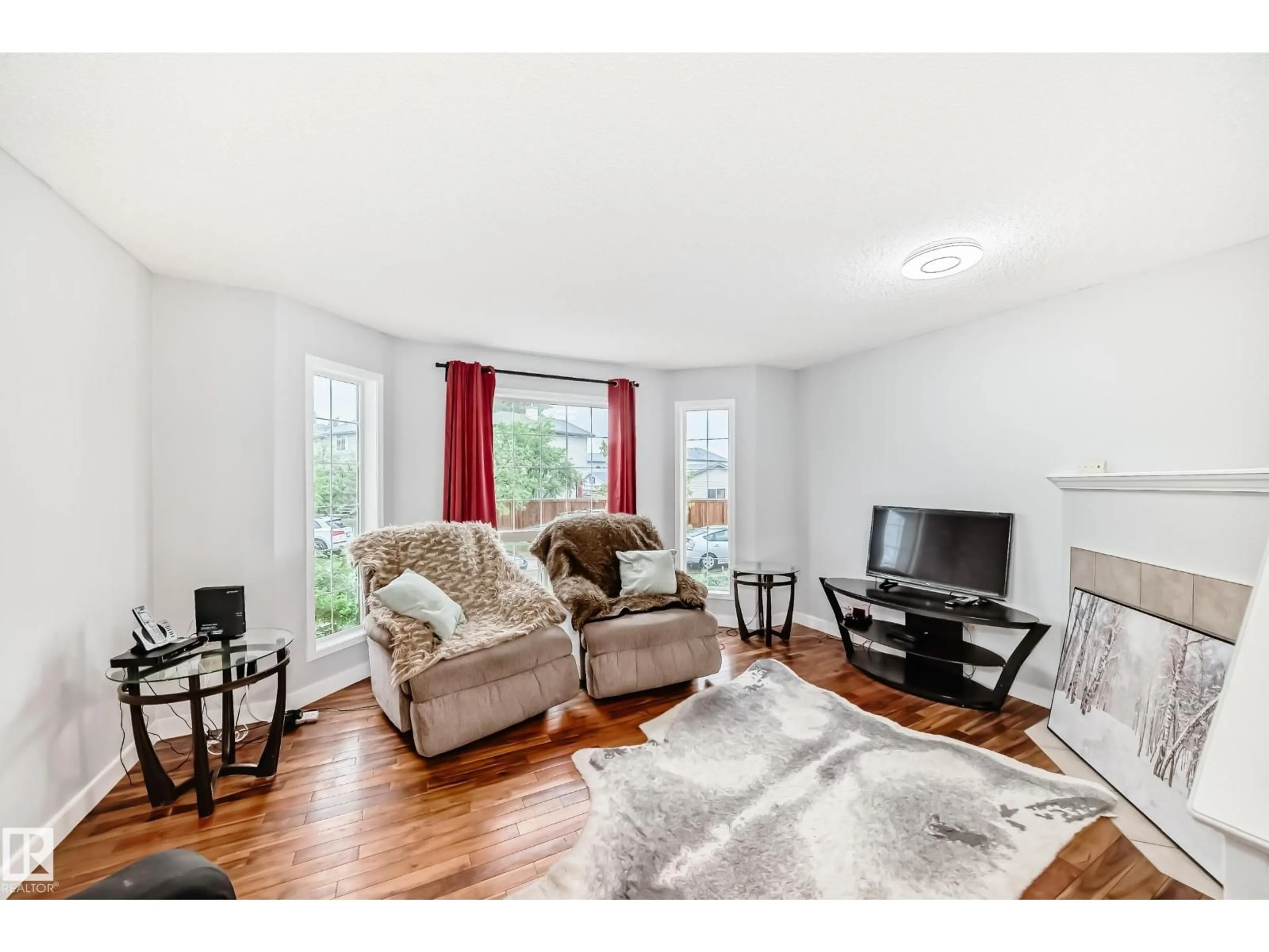 Living room with furniture, wood/laminate floor for 8 CAMPBELL CO, Leduc Alberta T9E8J9