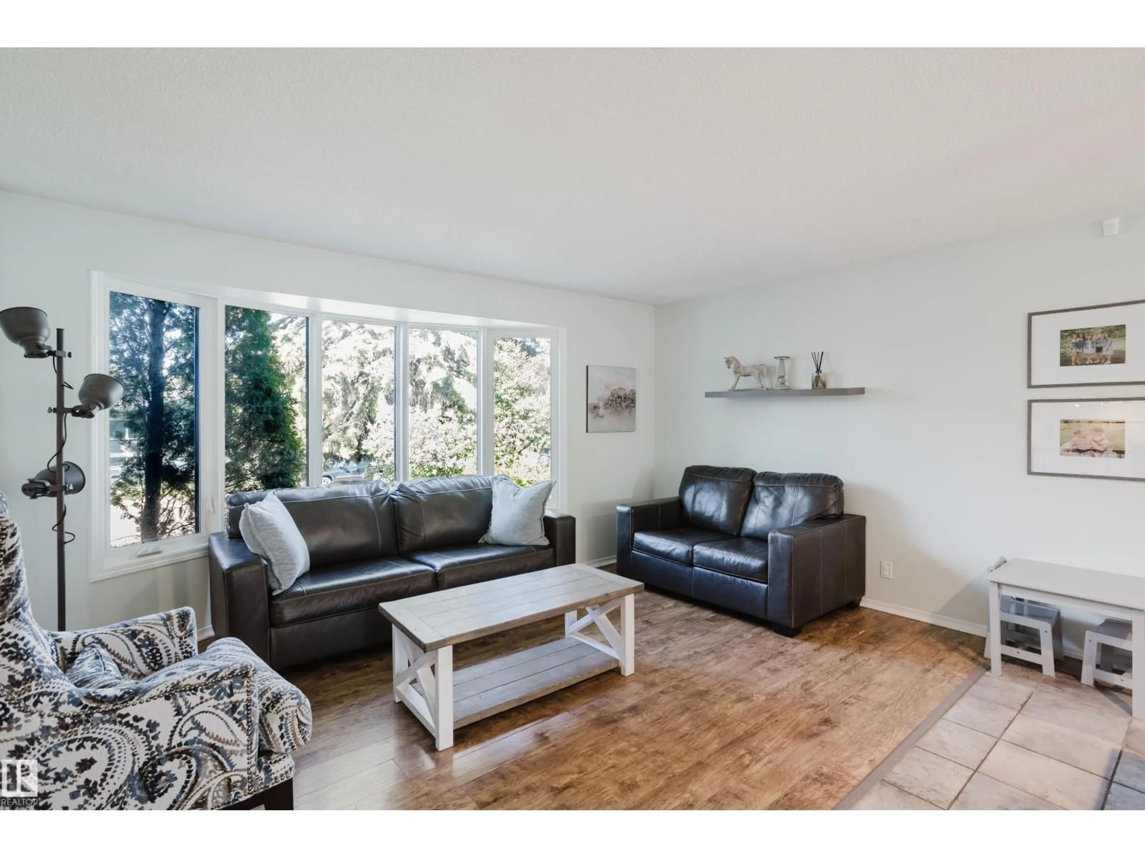 Living room with furniture, wood/laminate floor for 33 MILL DR, St. Albert Alberta T8N1J5