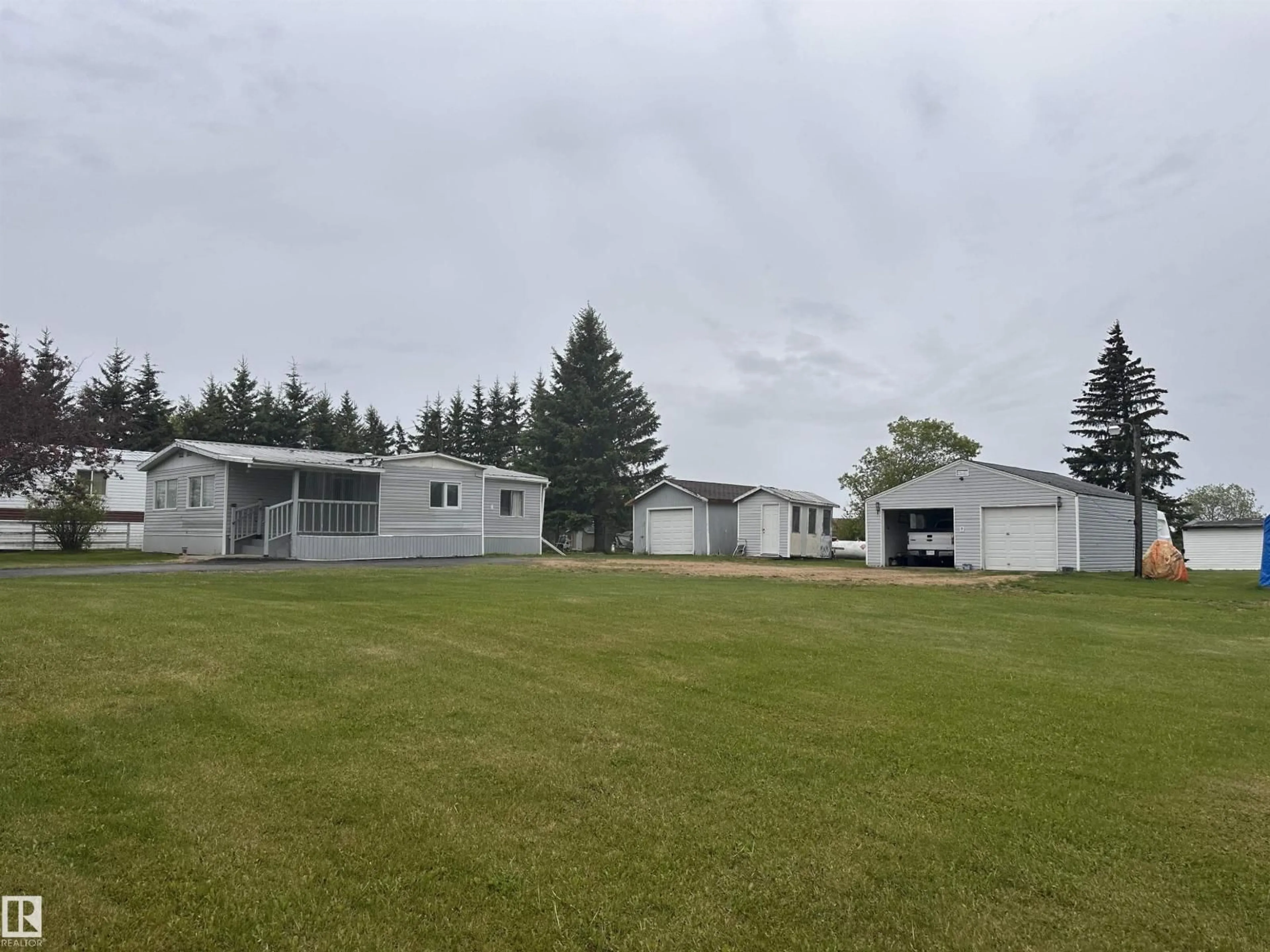 A pic from outside/outdoor area/front of a property/back of a property/a pic from drone, building for 4612 50 ST, Fawcett Alberta T0G0Y0