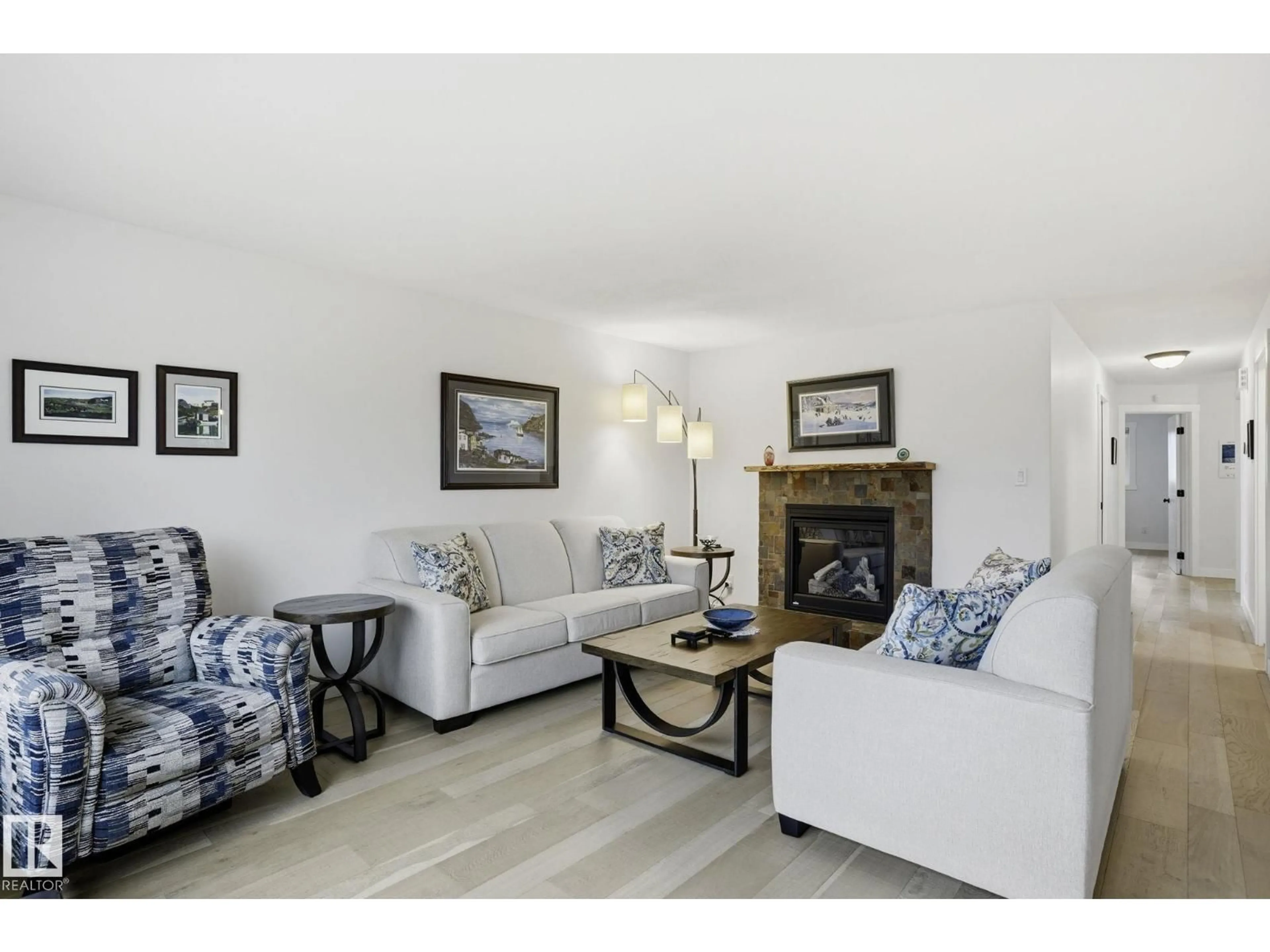 Living room with furniture, wood/laminate floor for 4502 53 AV, Leduc Alberta T9E5W3