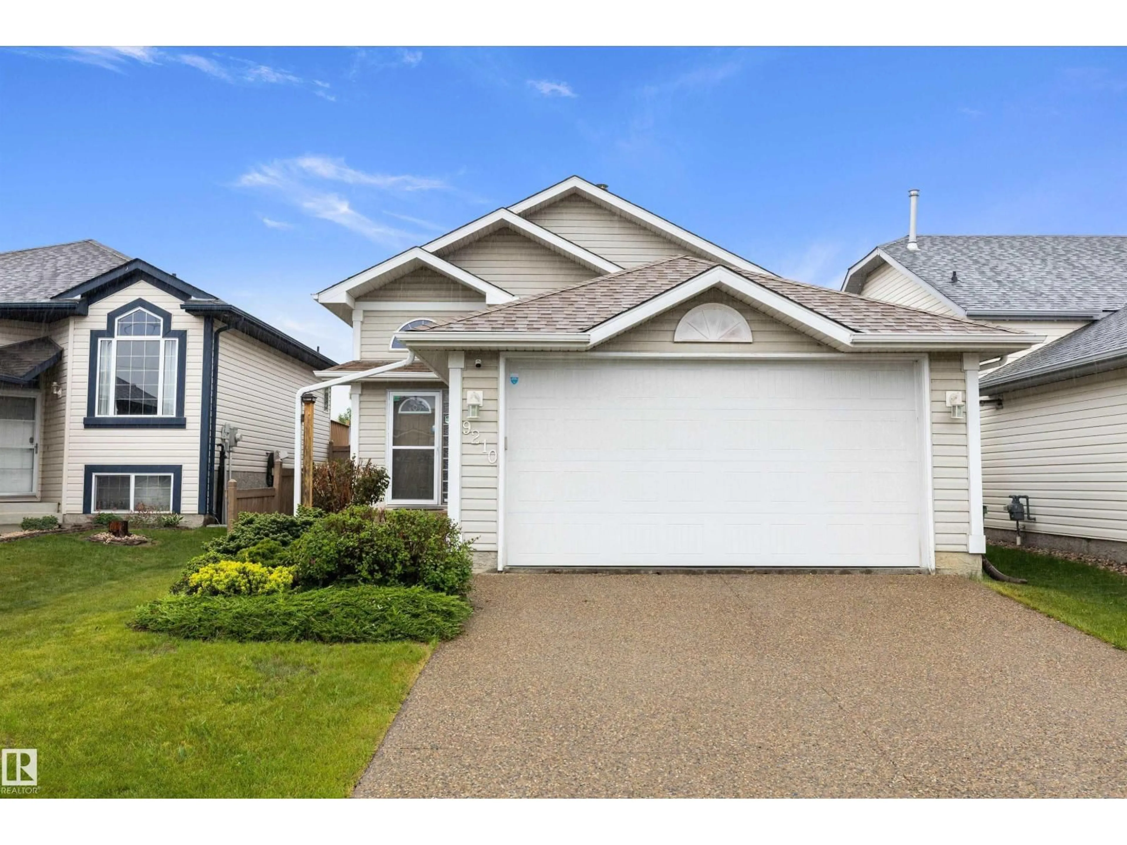 Home with vinyl exterior material, street for NW - 9210 163 AV, Edmonton Alberta T5Z3M8