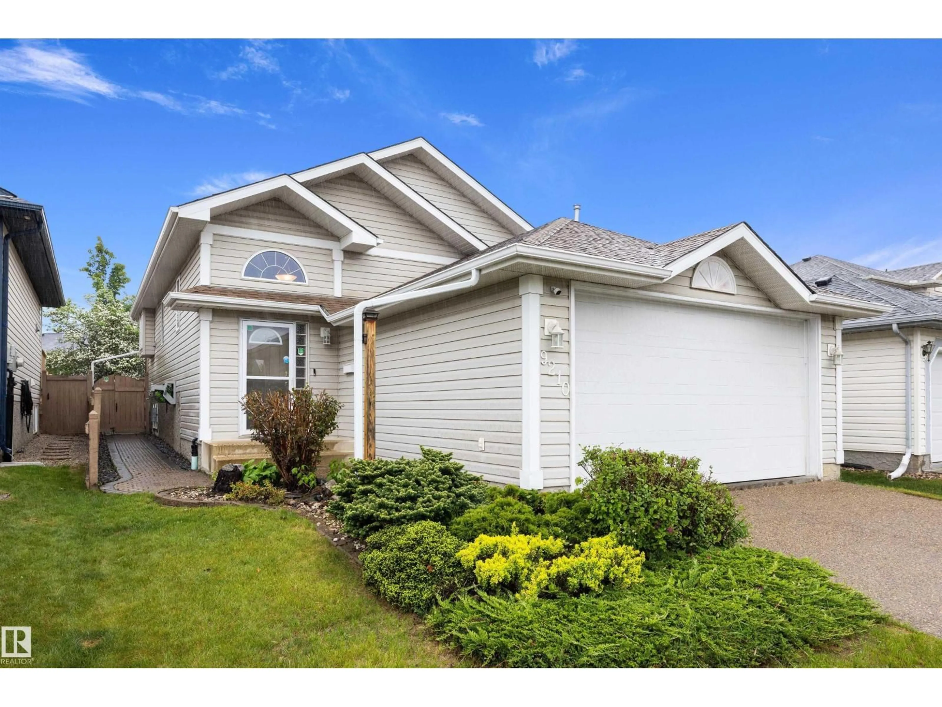 Home with vinyl exterior material, street for NW - 9210 163 AV, Edmonton Alberta T5Z3M8