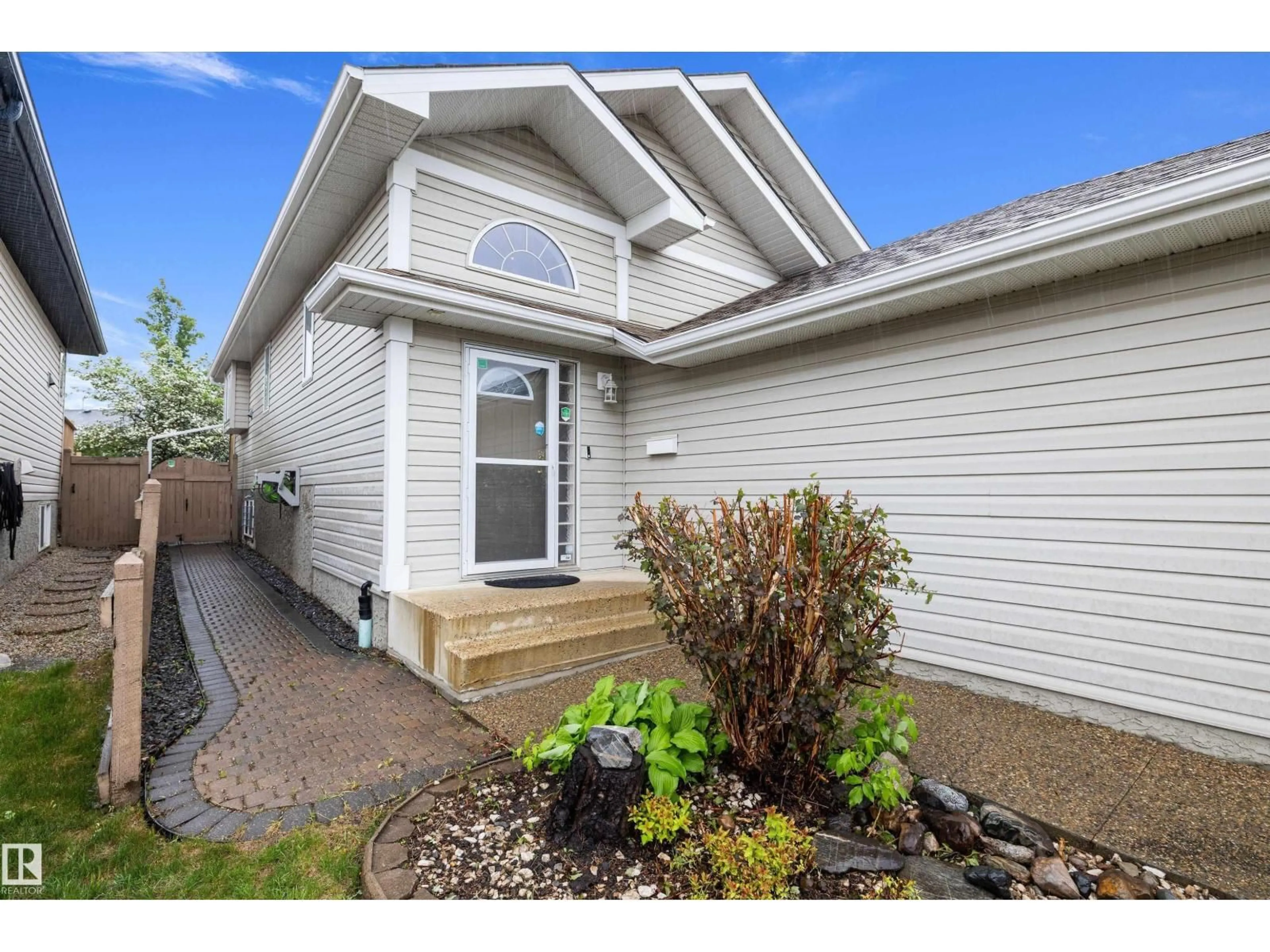 Home with vinyl exterior material, street for NW - 9210 163 AV, Edmonton Alberta T5Z3M8