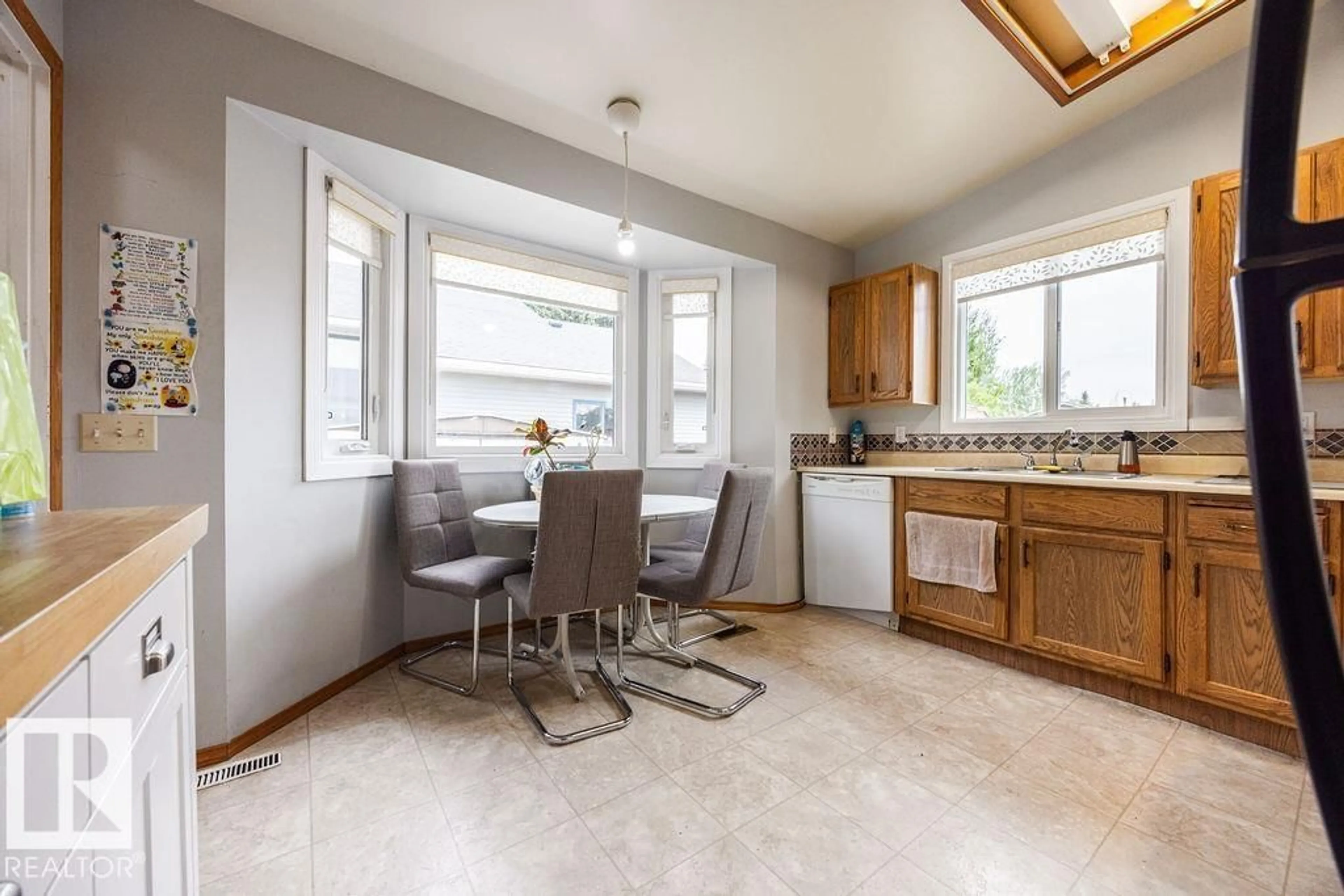 Open concept kitchen, ceramic/tile floor for 1139 35 ST, Edmonton Alberta T6L2L3