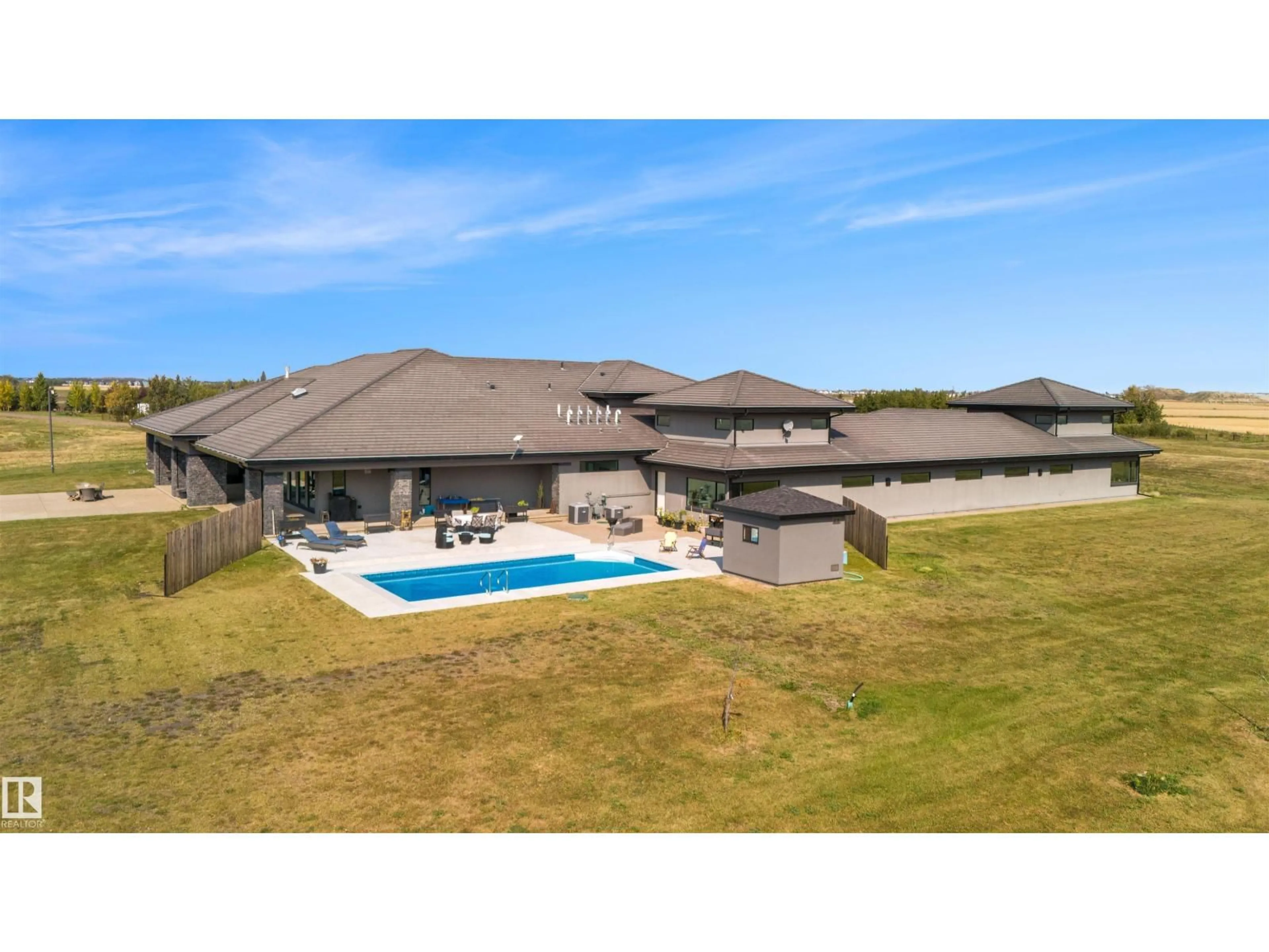 A pic from outside/outdoor area/front of a property/back of a property/a pic from drone, water/lake/river/ocean view for 25056 TWP ROAD 492, Rural Leduc County Alberta T4X2M6