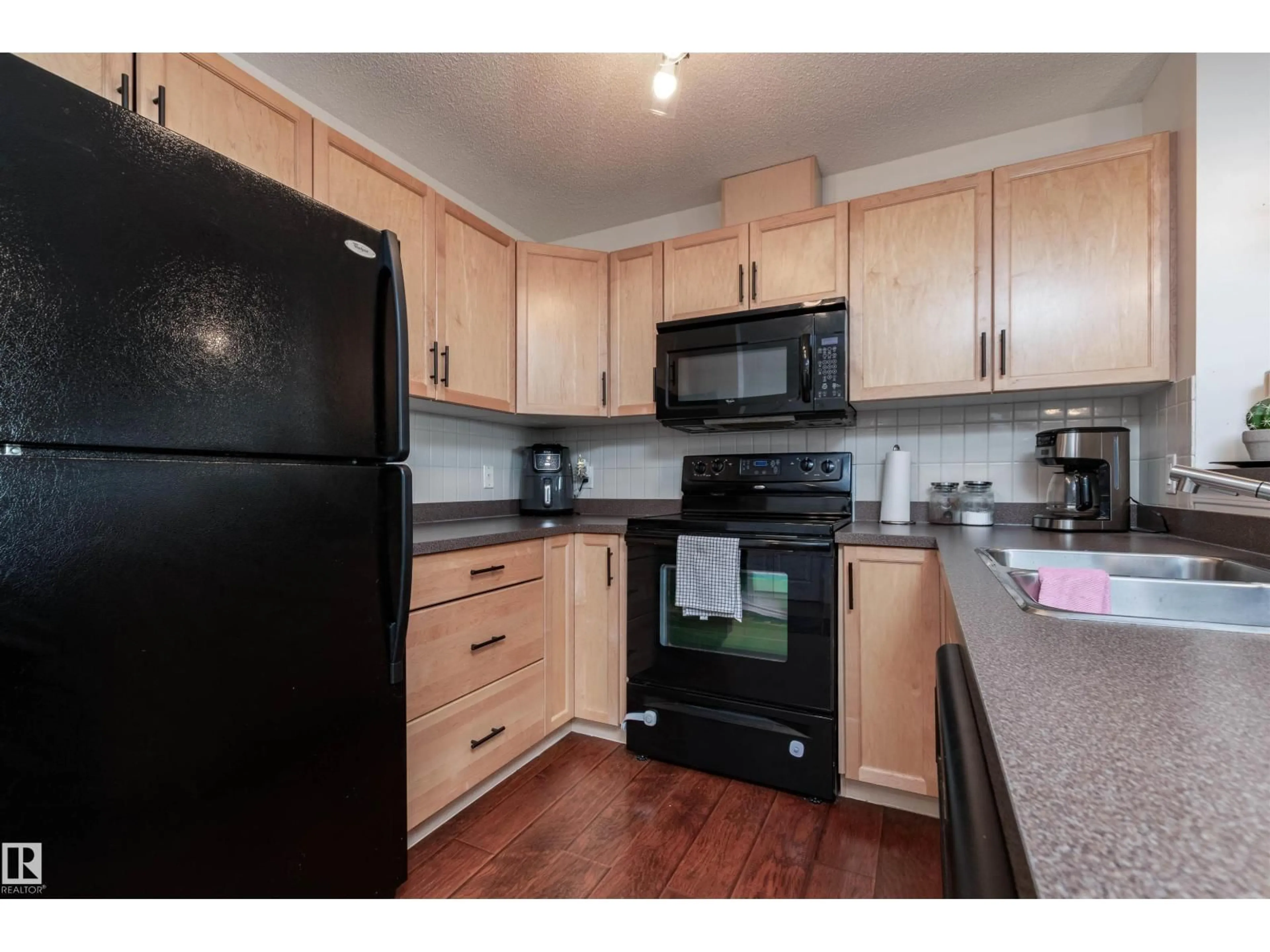 Standard kitchen, wood/laminate floor for #303 - 5951 165 AV, Edmonton Alberta T5Y0J6