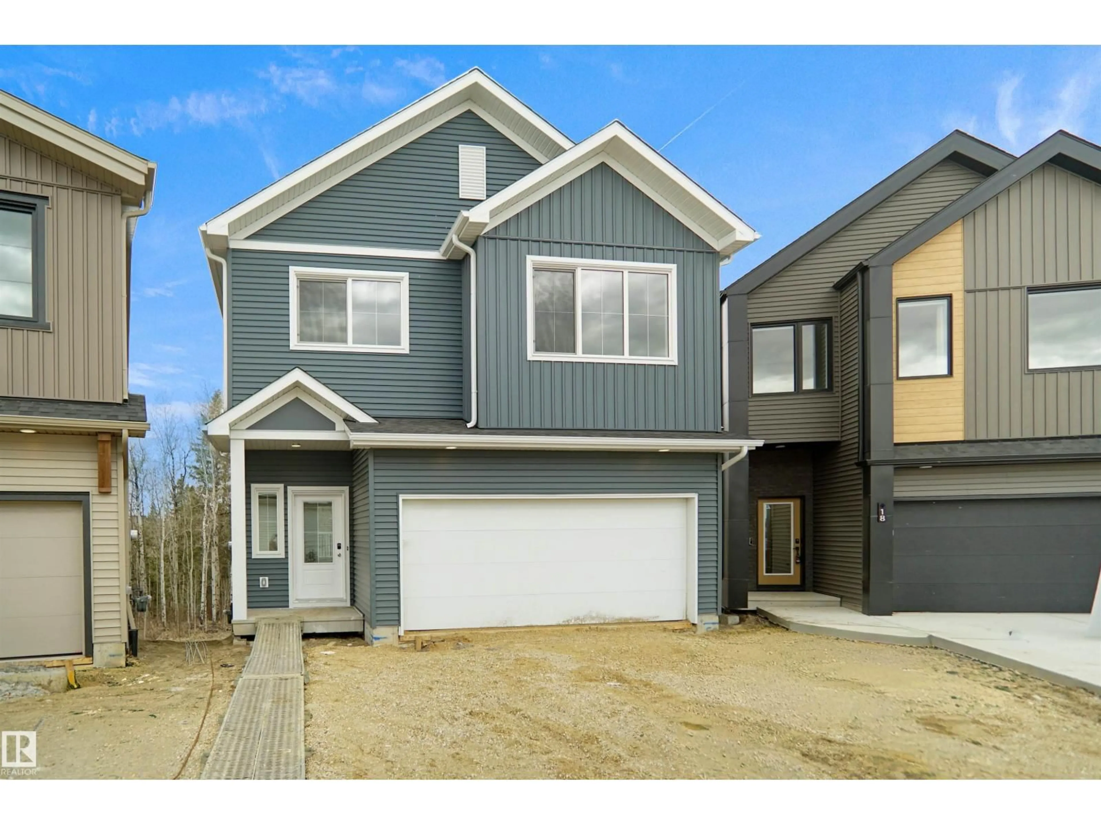 Home with vinyl exterior material, street for 19 19904 31 AV NW, Edmonton Alberta T6M1N7