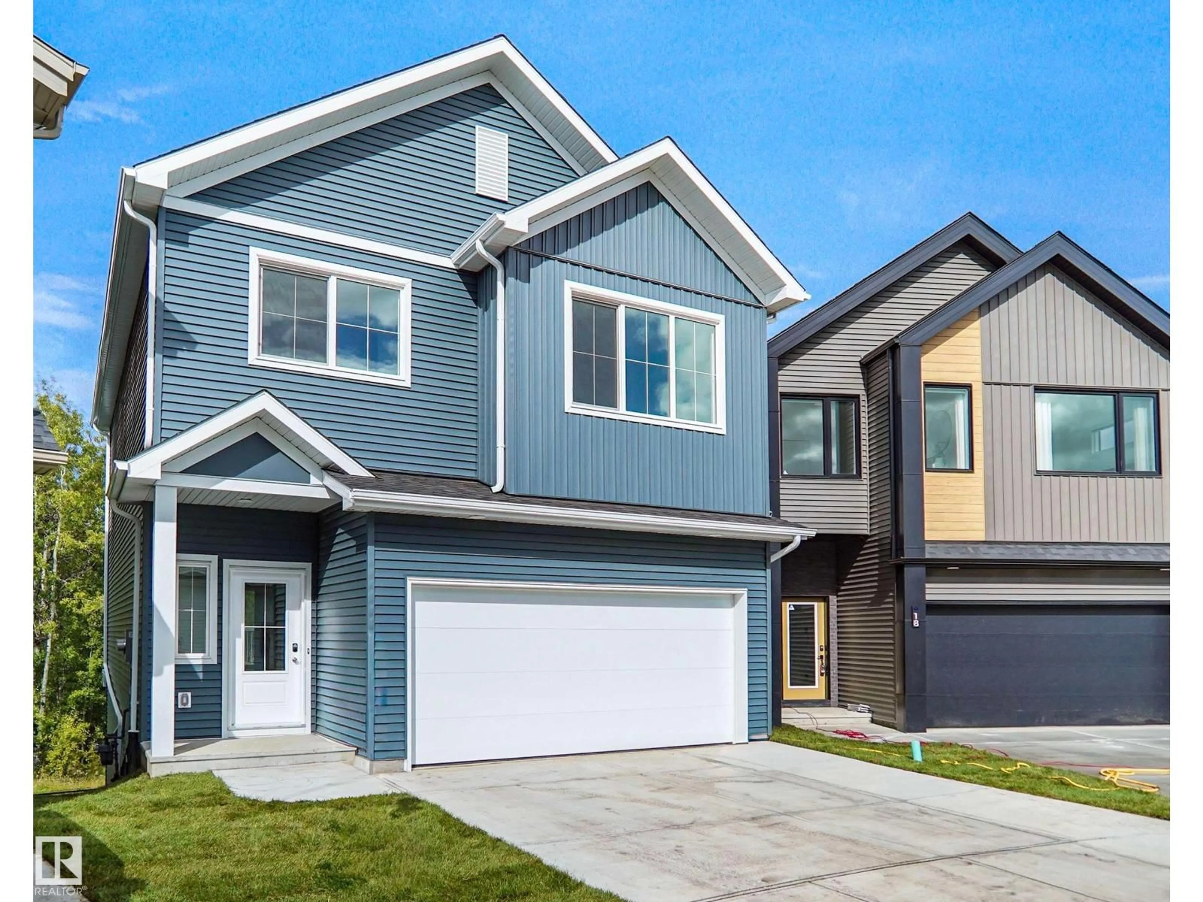 Home with vinyl exterior material, street for 19 19904 31 AV NW, Edmonton Alberta T6M1N7