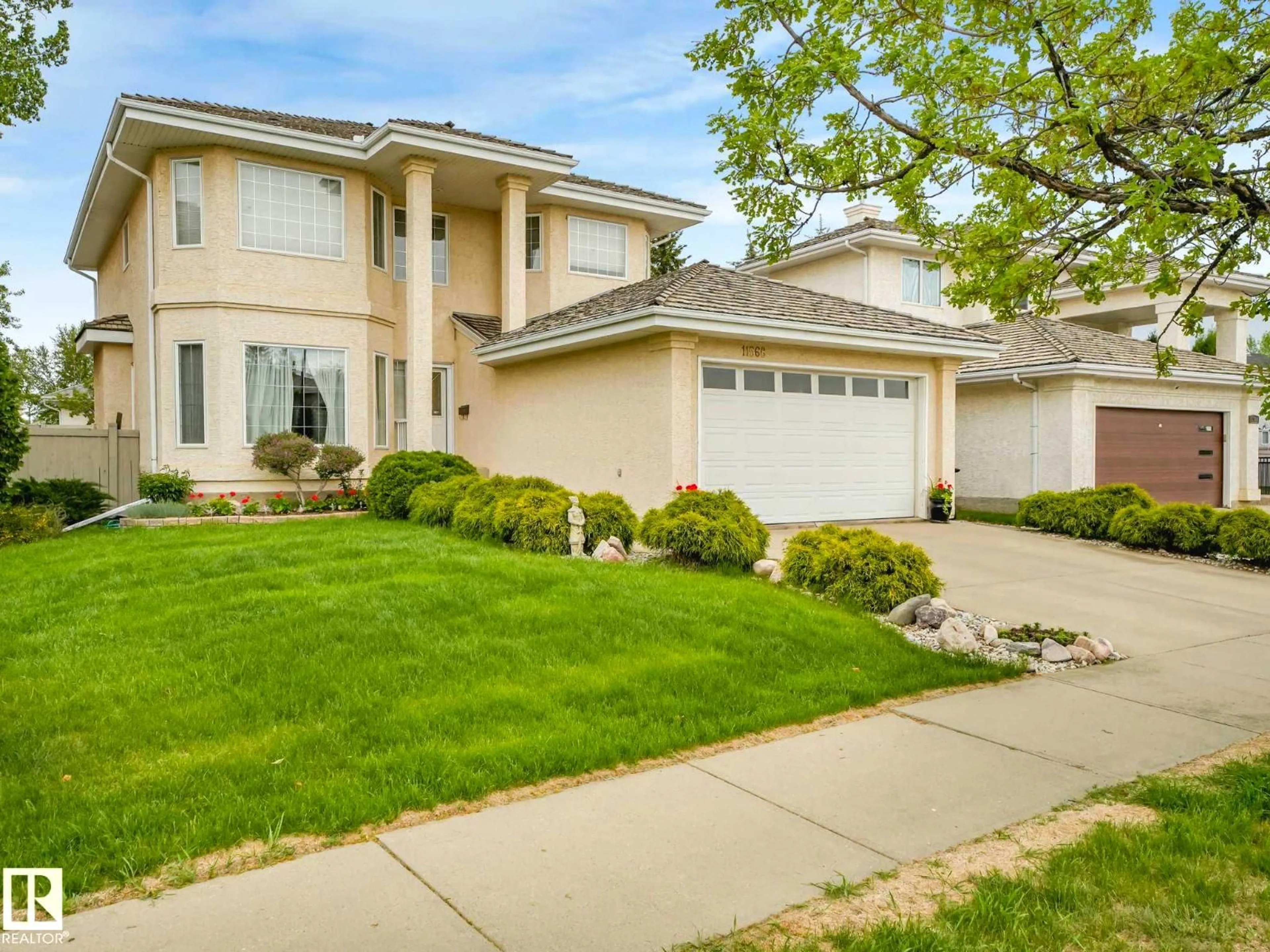 Home with vinyl exterior material, street for 11568 15 AV, Edmonton Alberta T6J7C9