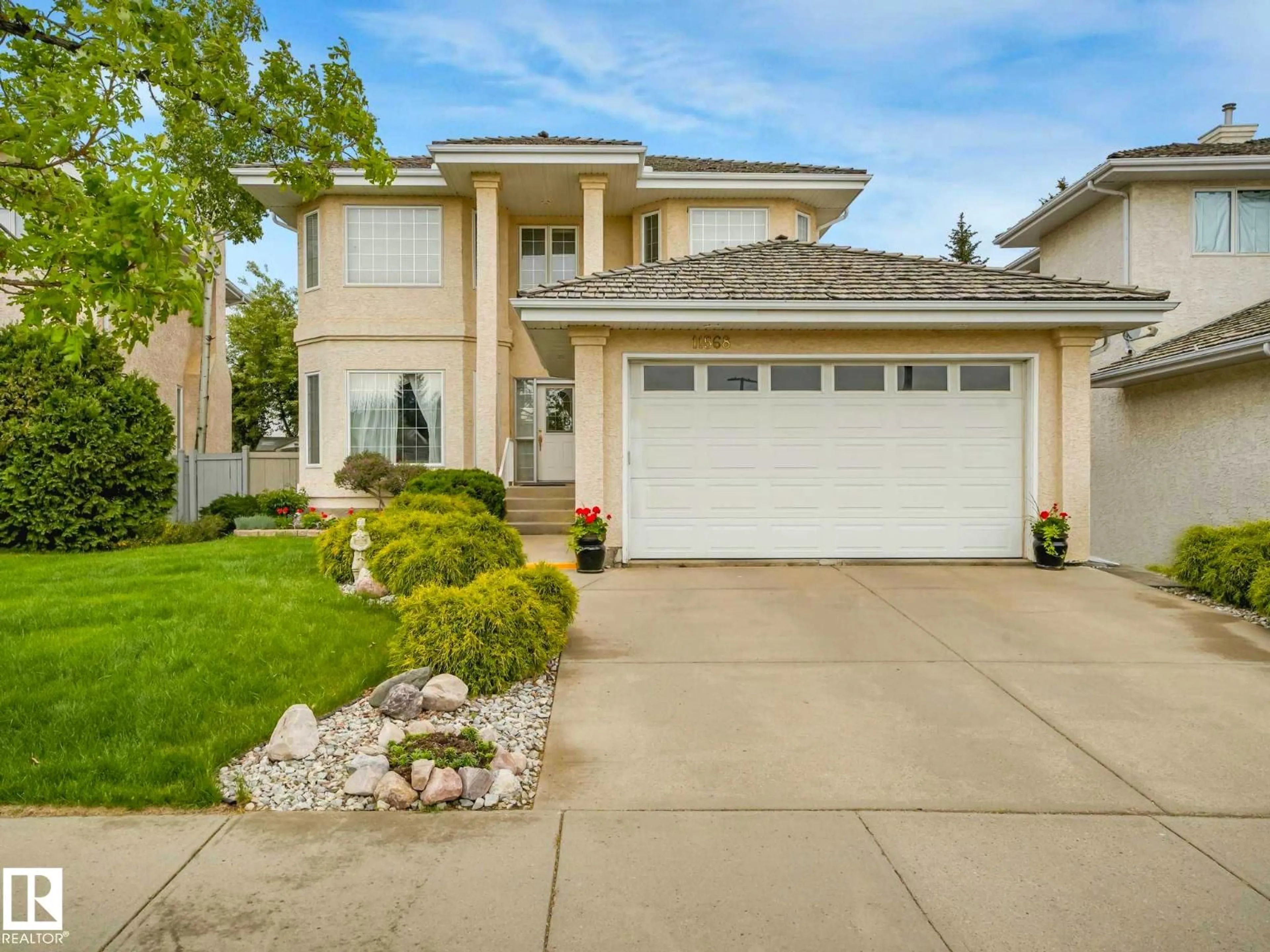 Home with vinyl exterior material, street for 11568 15 AV, Edmonton Alberta T6J7C9