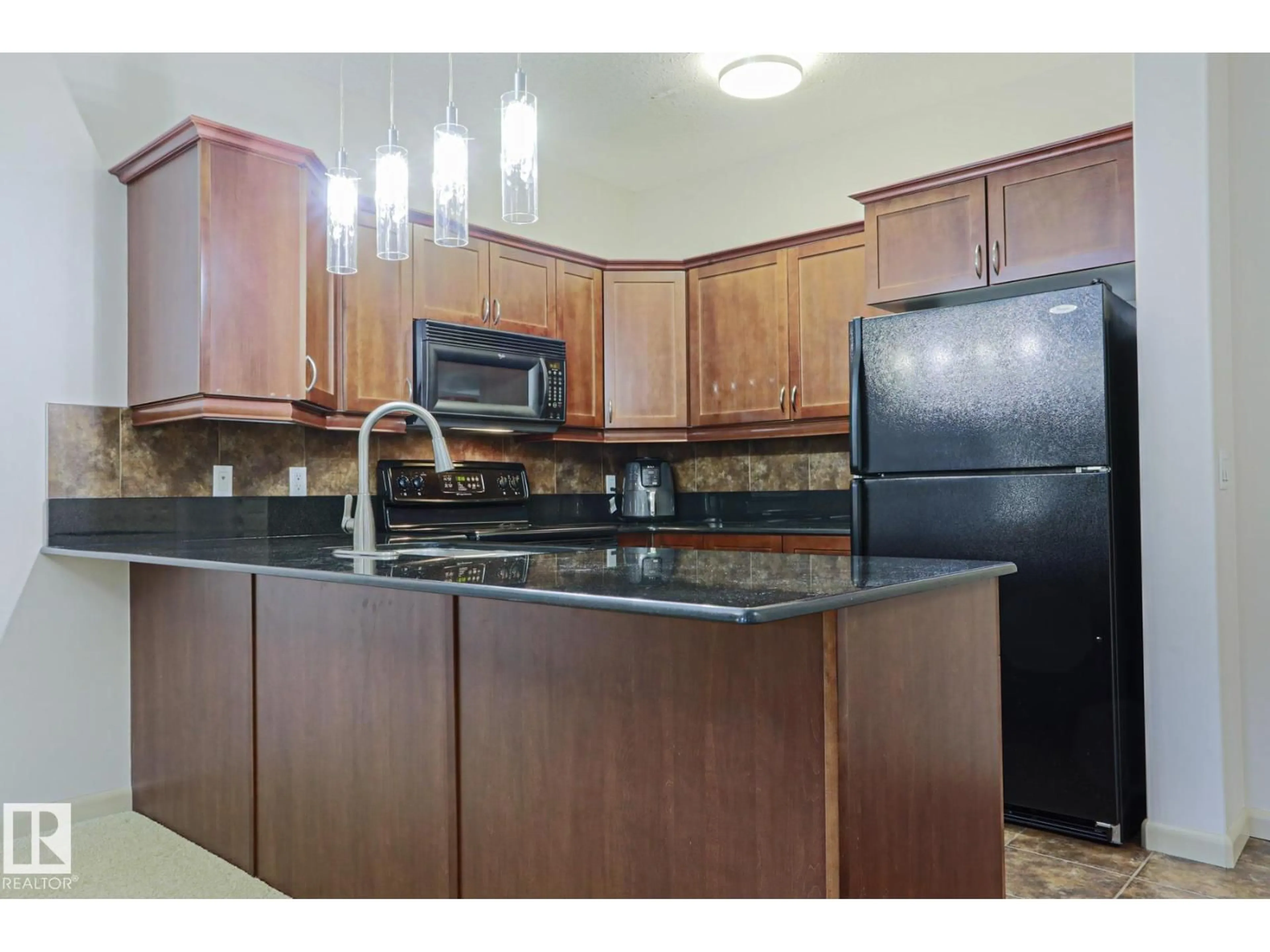 Standard kitchen, unknown for 160 - 117 MAGRATH RD, Edmonton Alberta T6R3T7