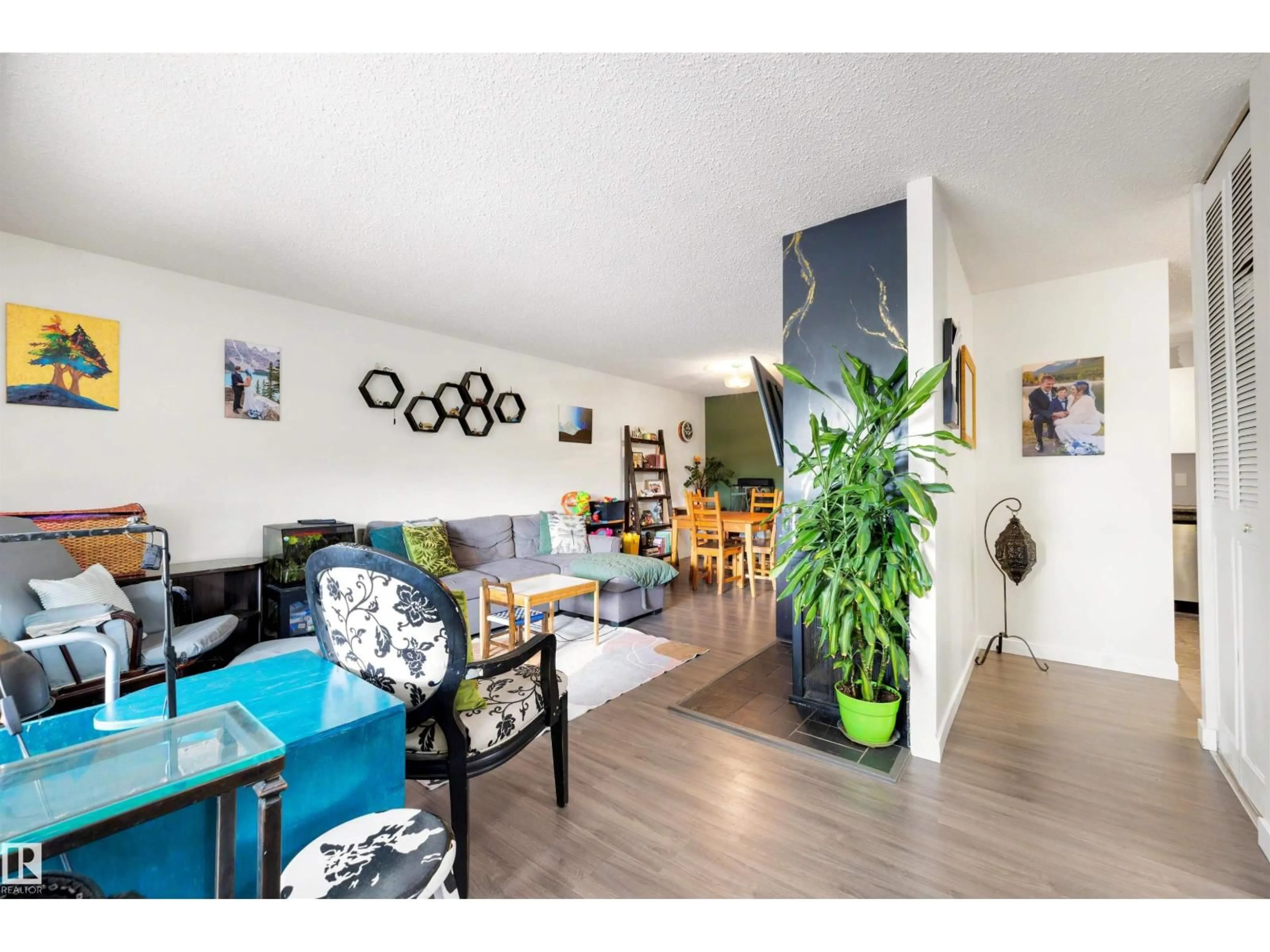 Living room with furniture, wood/laminate floor for 241 SURREY GARDENS GD, Edmonton Alberta T5T1Z3