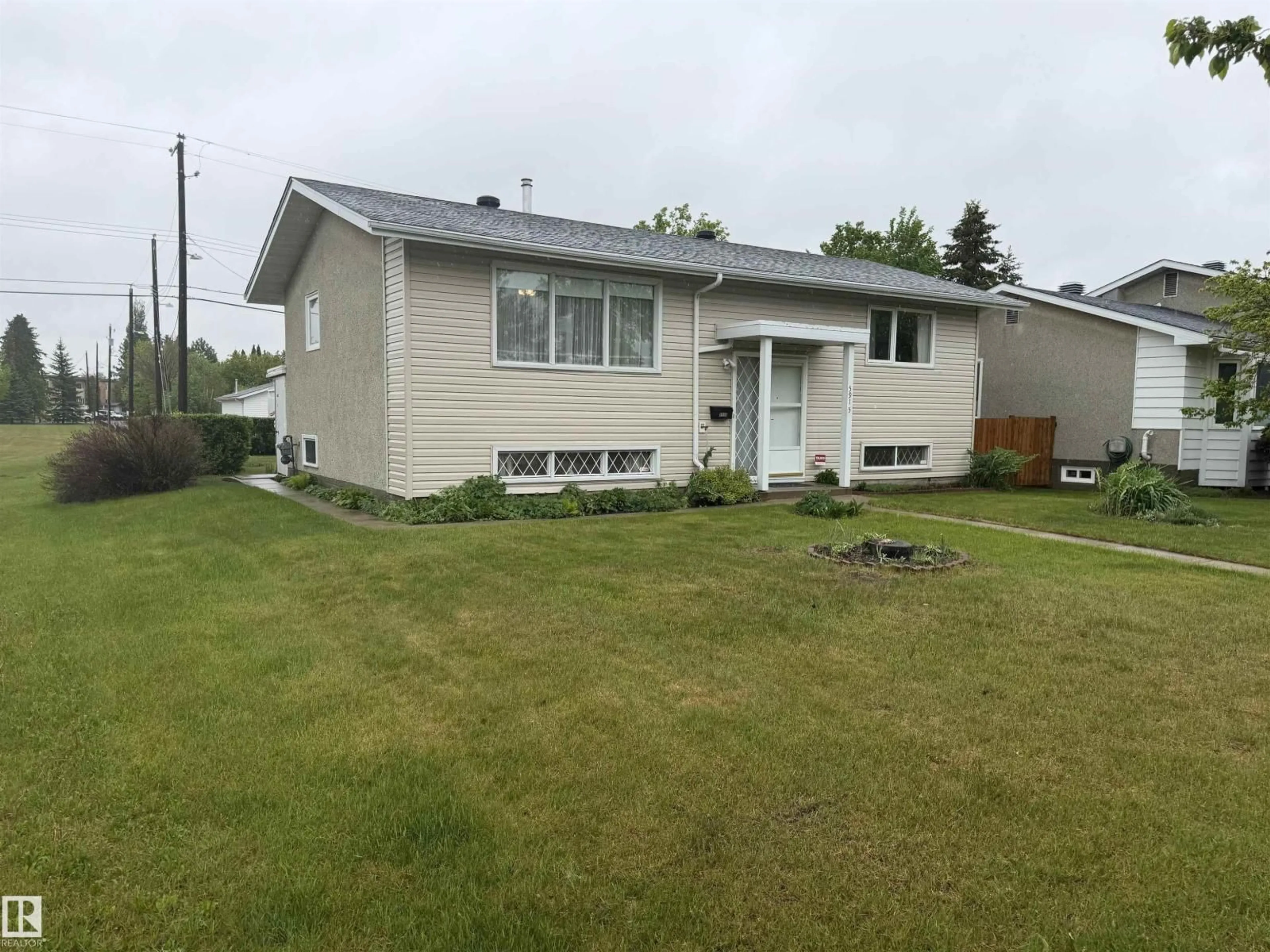 Home with vinyl exterior material, street for 5915 115 ST, Edmonton Alberta T6H3P6