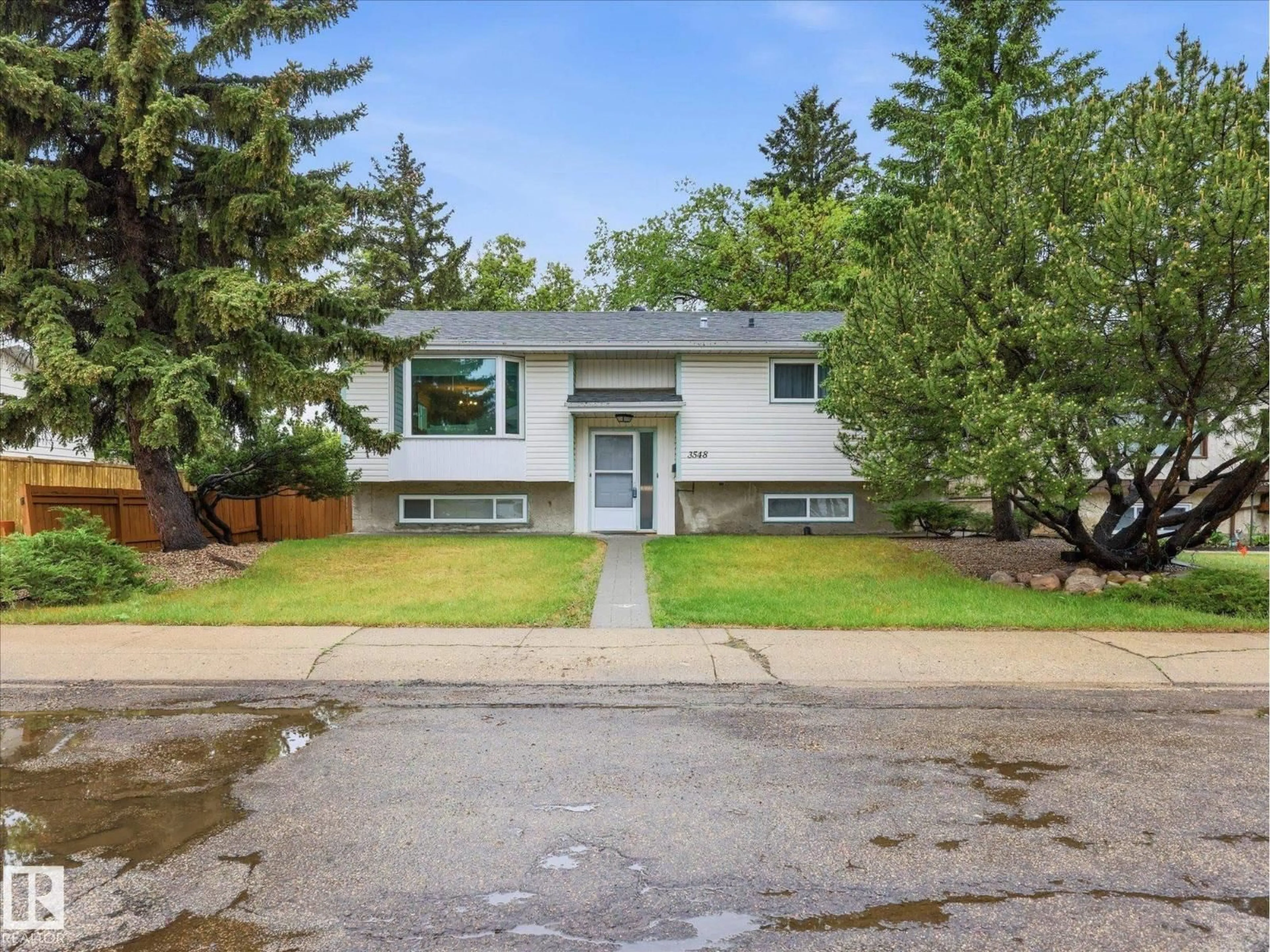 Home with vinyl exterior material, street for 3548 65 ST, Edmonton Alberta T6L1G4