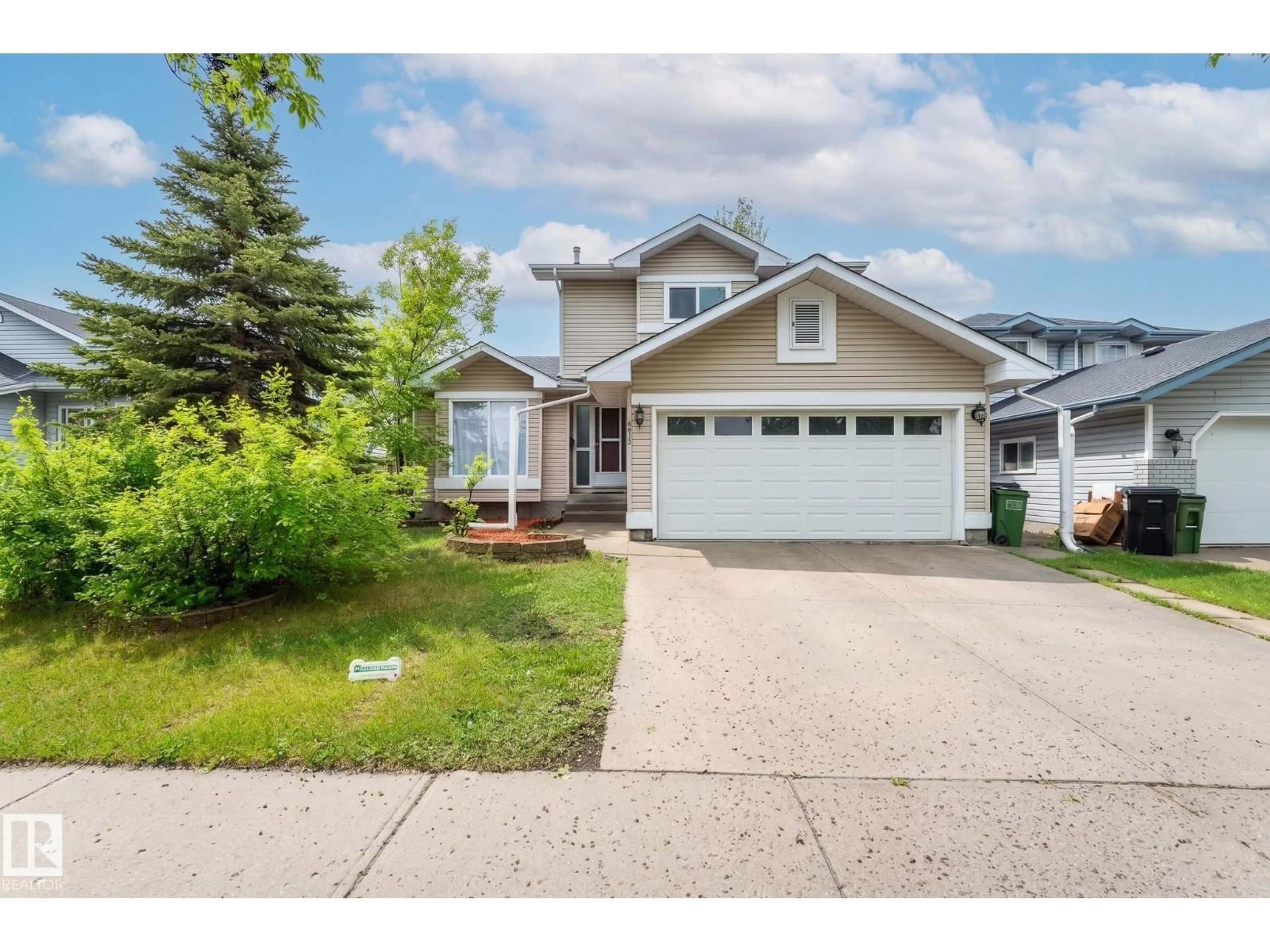 Home with vinyl exterior material, street for 16811 91 ST, Edmonton Alberta T5Z2W7