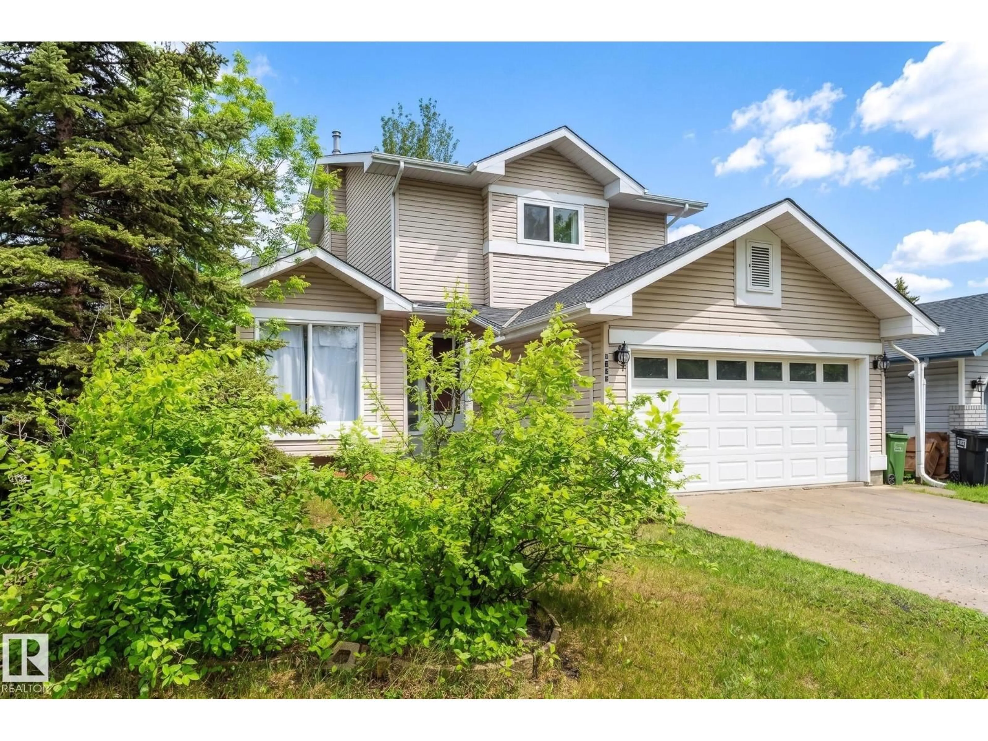 Home with vinyl exterior material, street for 16811 91 ST, Edmonton Alberta T5Z2W7