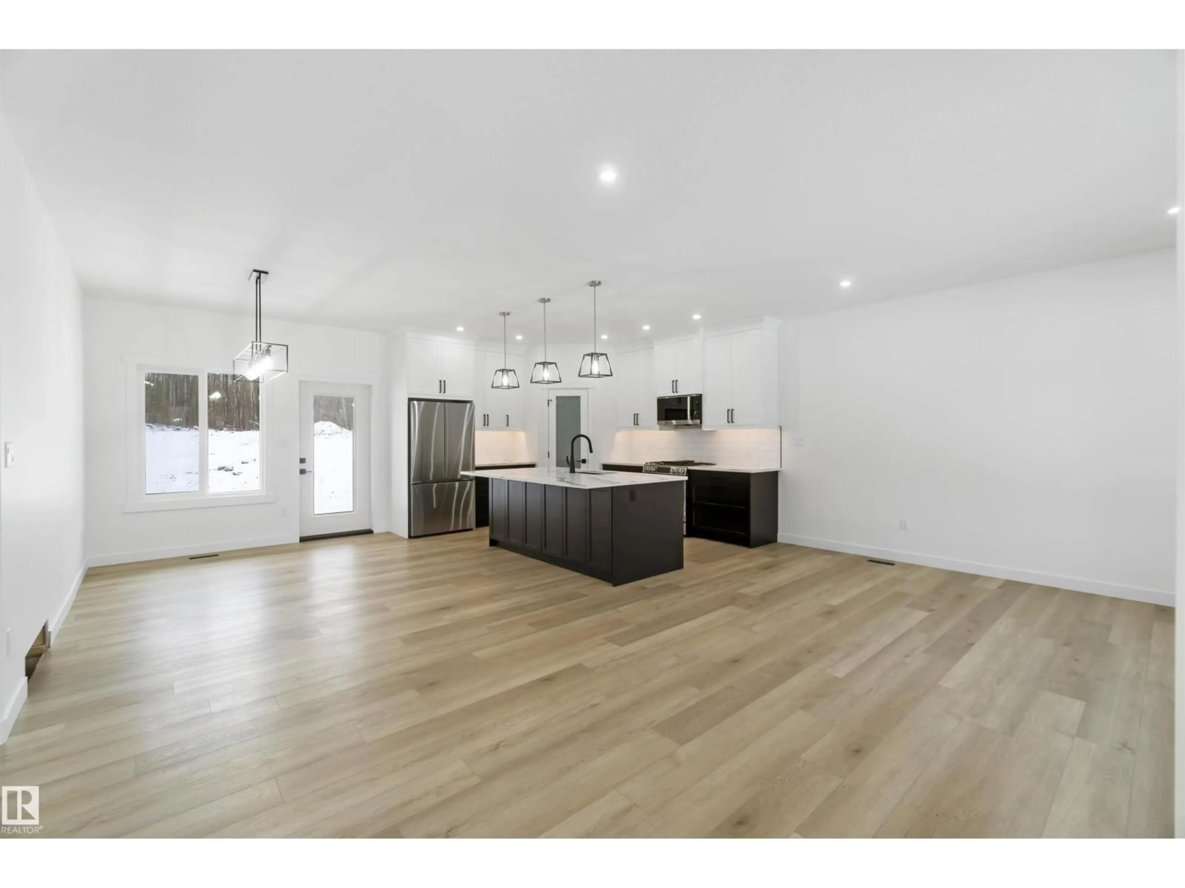 Open concept kitchen, wood/laminate floor for 100 54127 RGE ROAD 30, Rural Lac Ste. Anne County Alberta T0E1V2