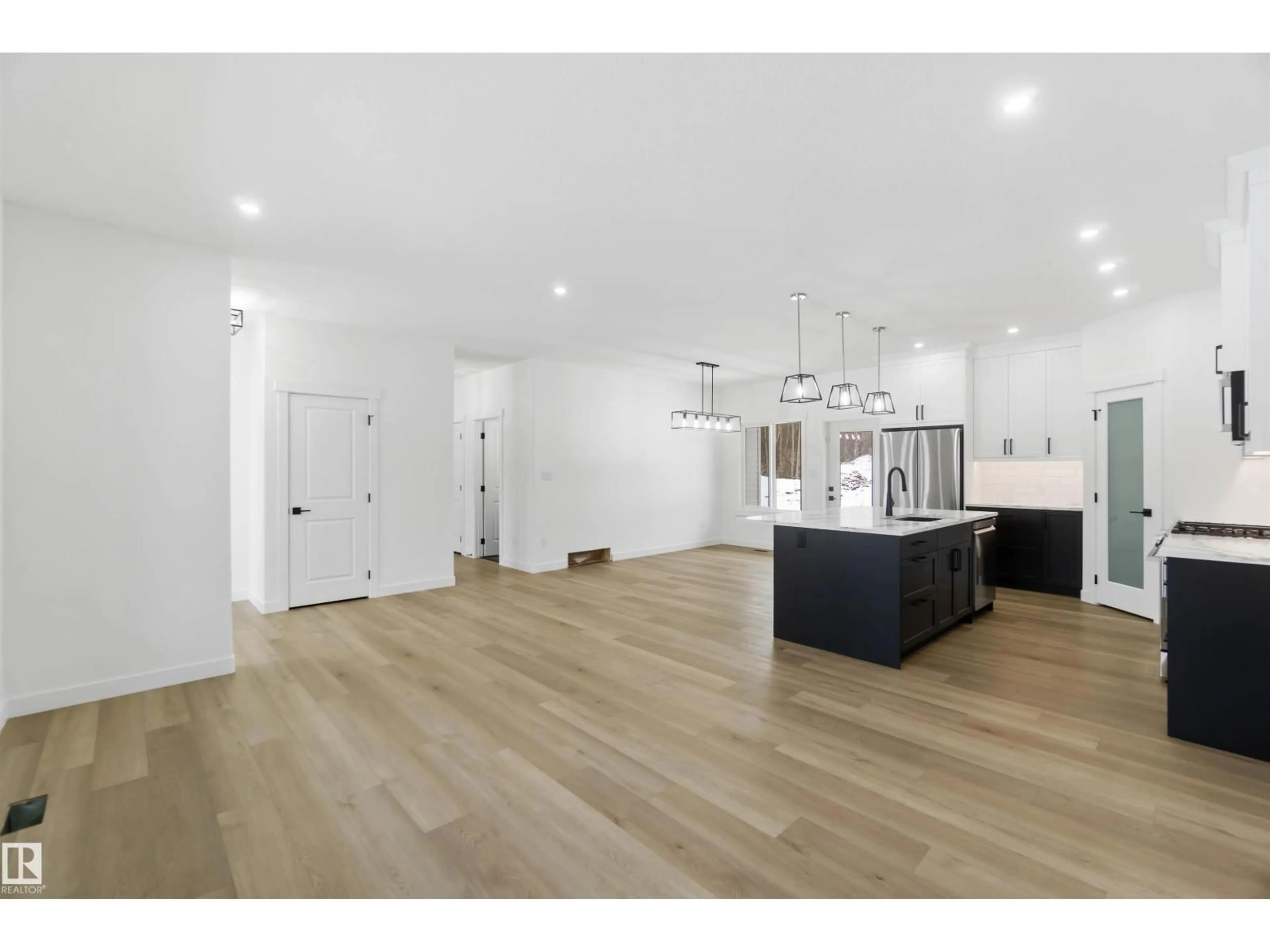 Open concept kitchen, wood/laminate floor for 100 54127 RGE ROAD 30, Rural Lac Ste. Anne County Alberta T0E1V2