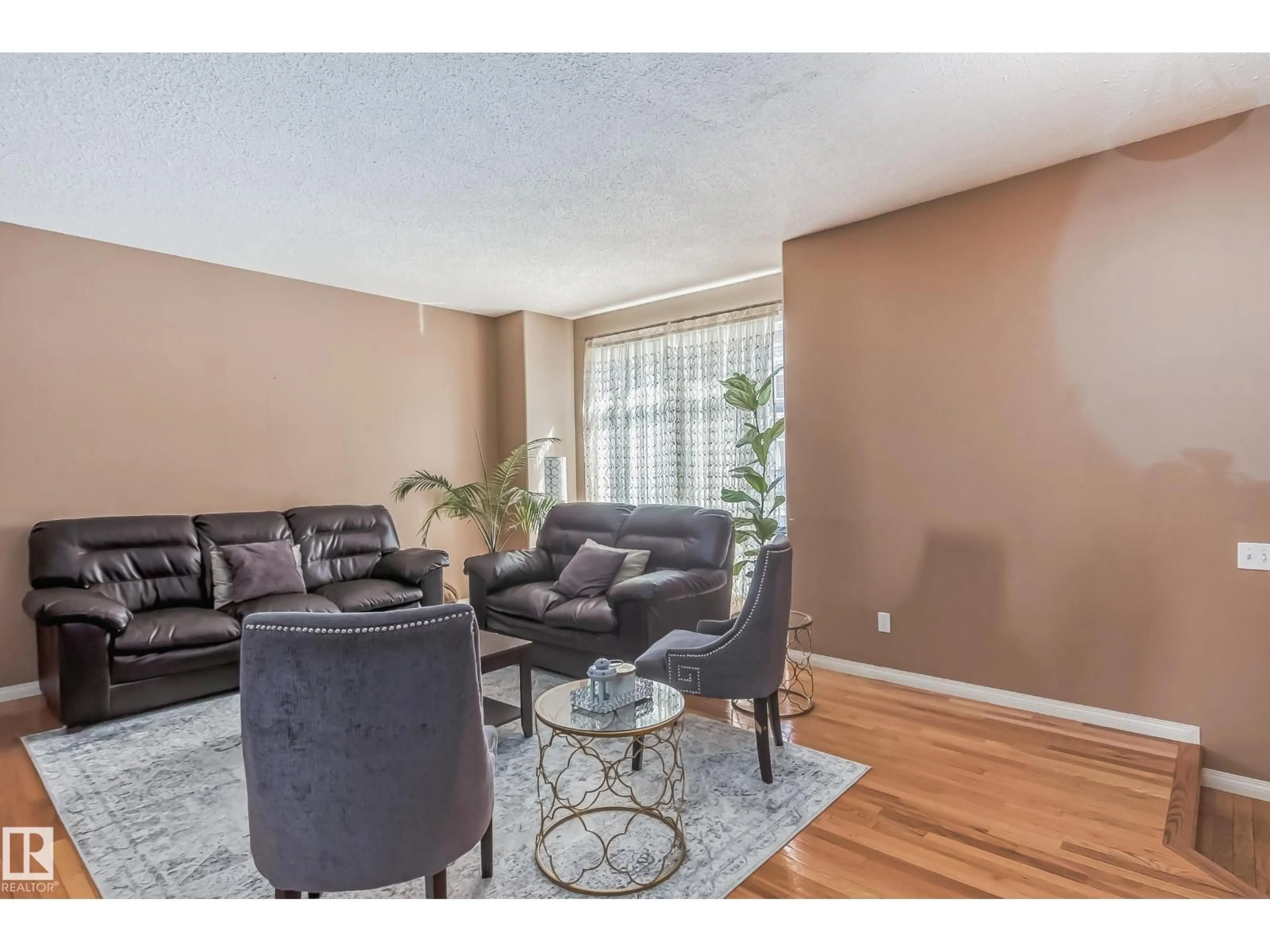 Living room with furniture, wood/laminate floor for #49 - 8403 164 AV, Edmonton Alberta T5Z3Y2