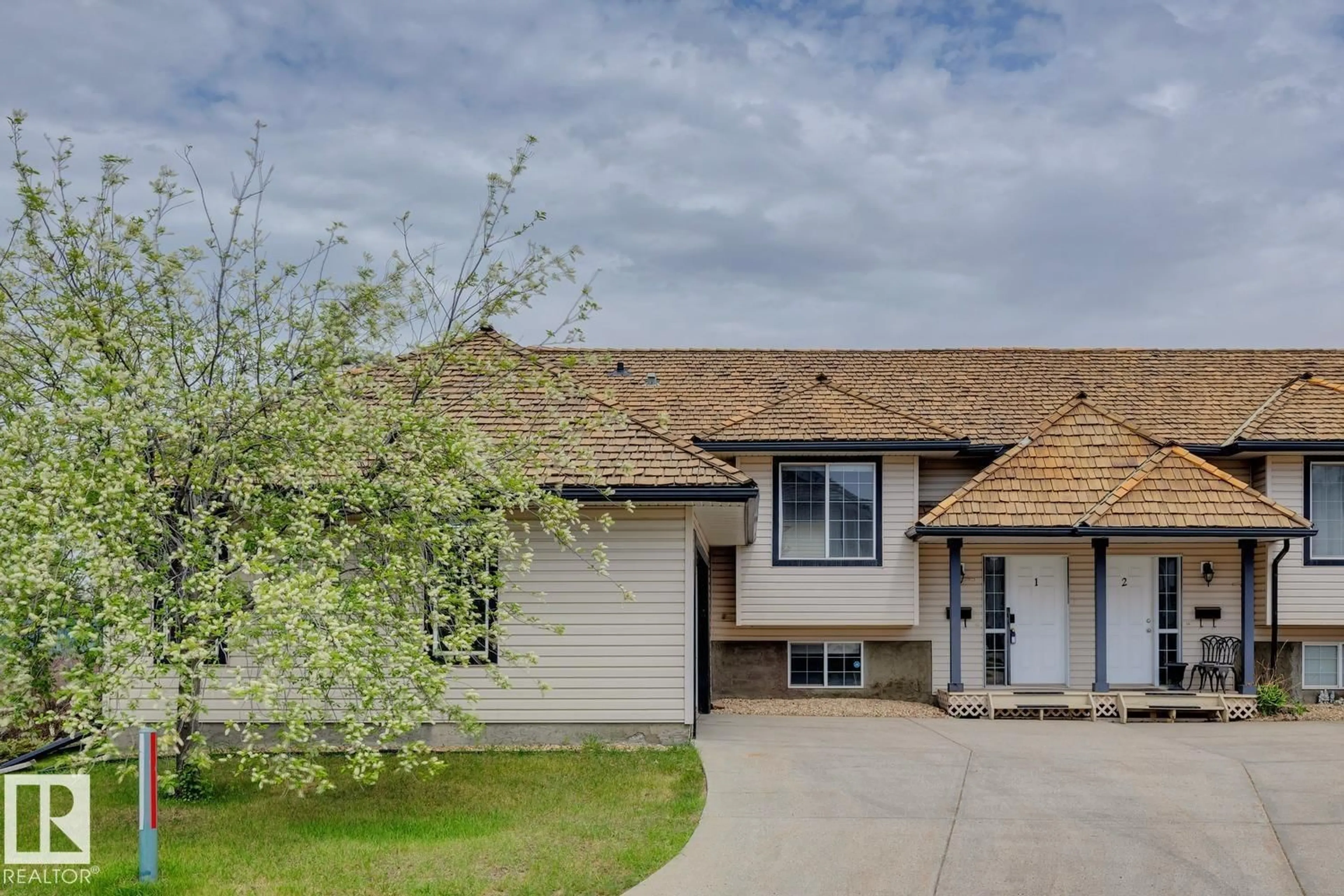 Home with vinyl exterior material, street for 225 BLACKBURN DR, Edmonton Alberta T6W1H1