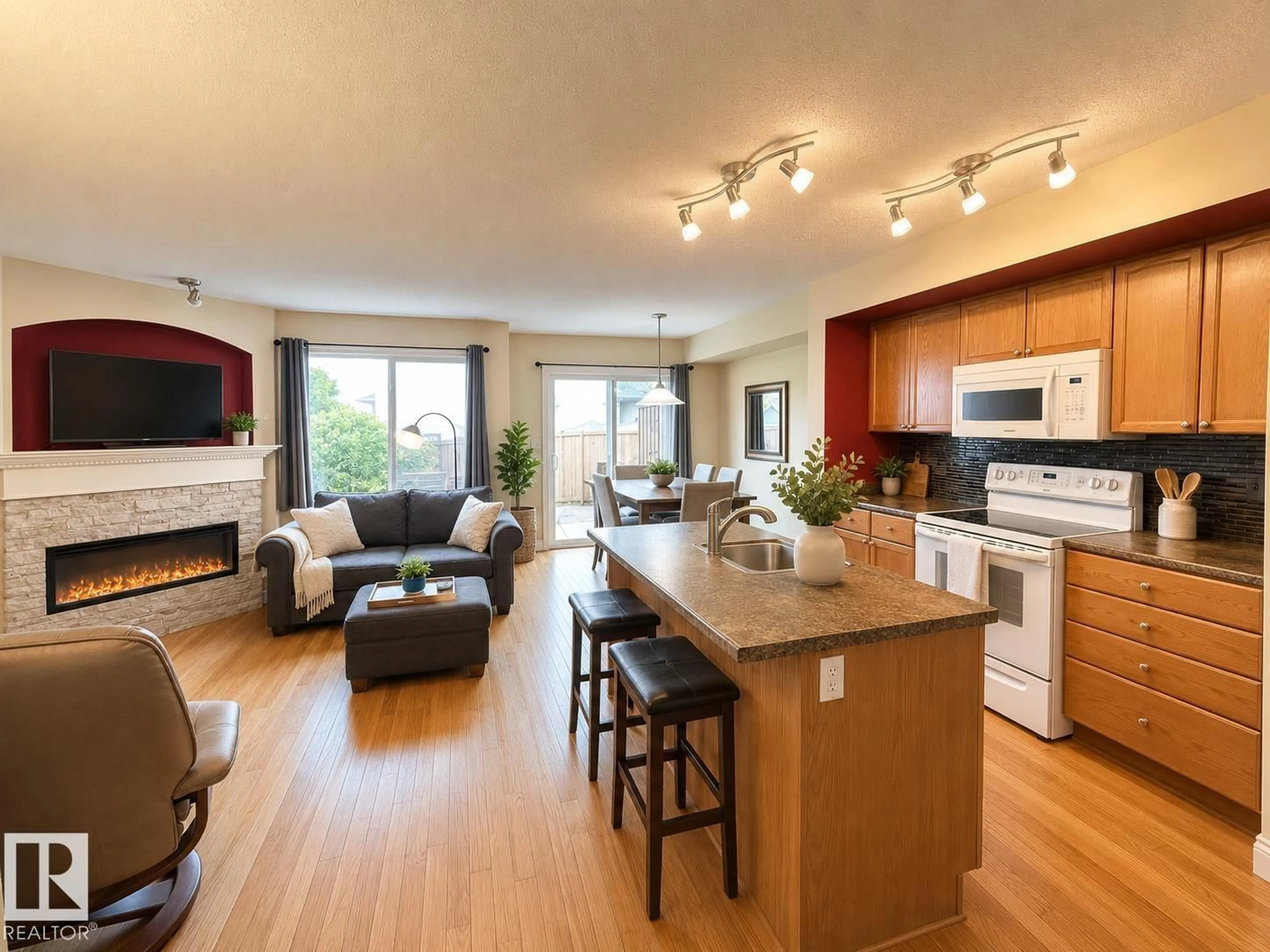 Open concept kitchen, wood/laminate floor for 102 HARTWICK LO, Spruce Grove Alberta T7X0A5