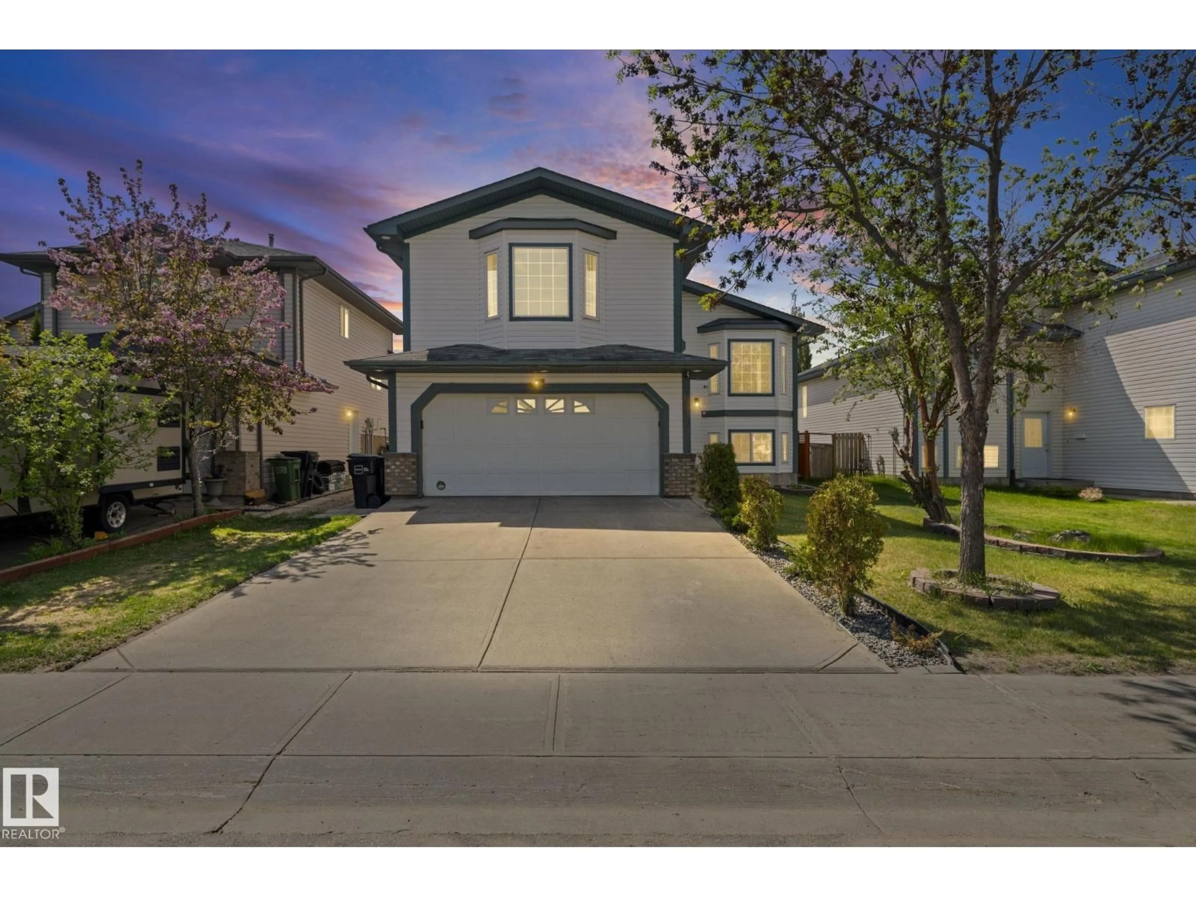 A pic from outside/outdoor area/front of a property/back of a property/a pic from drone, street for 6715 165 AV, Edmonton Alberta T5Z3M5