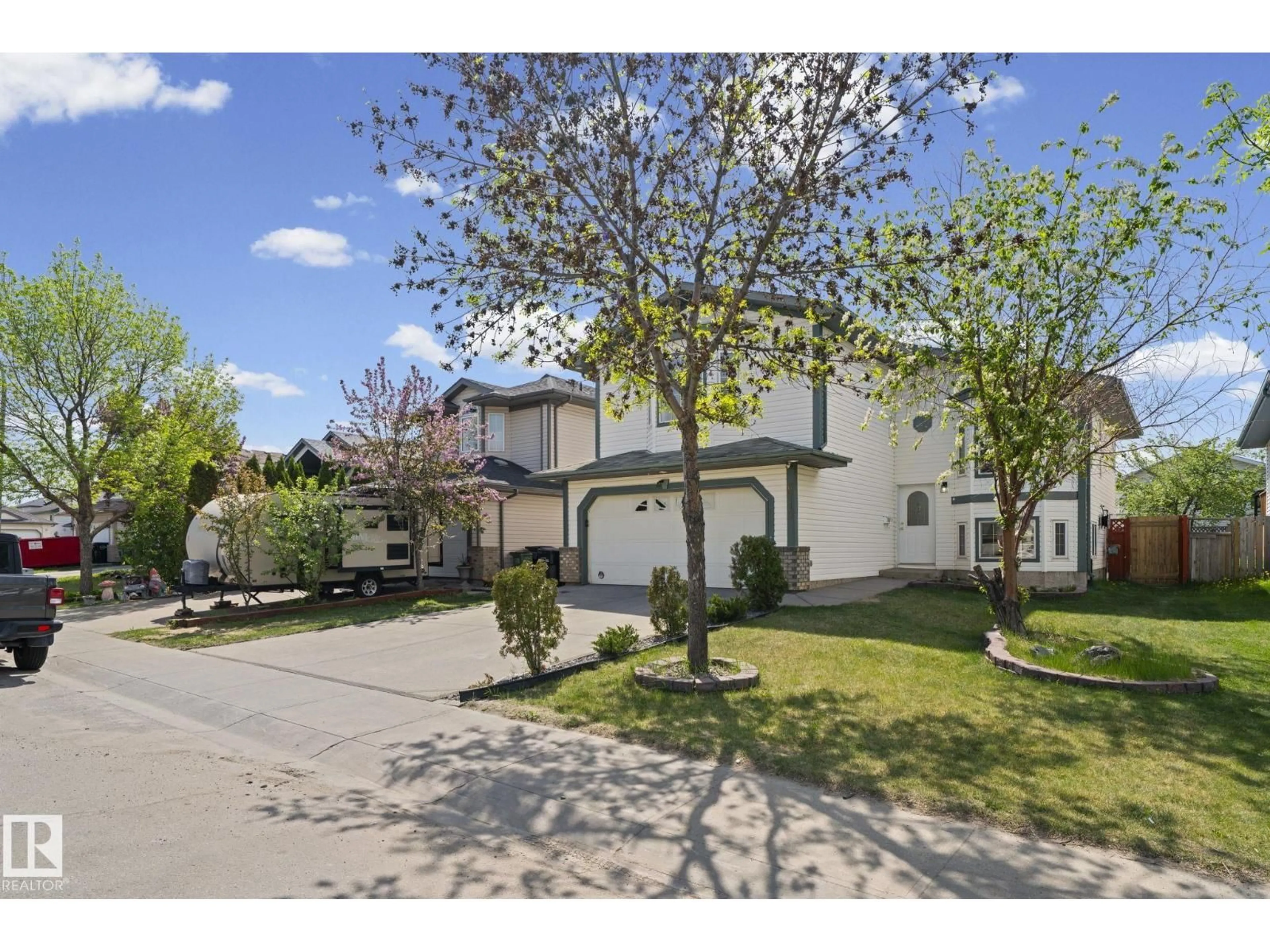 A pic from outside/outdoor area/front of a property/back of a property/a pic from drone, street for 6715 165 AV, Edmonton Alberta T5Z3M5