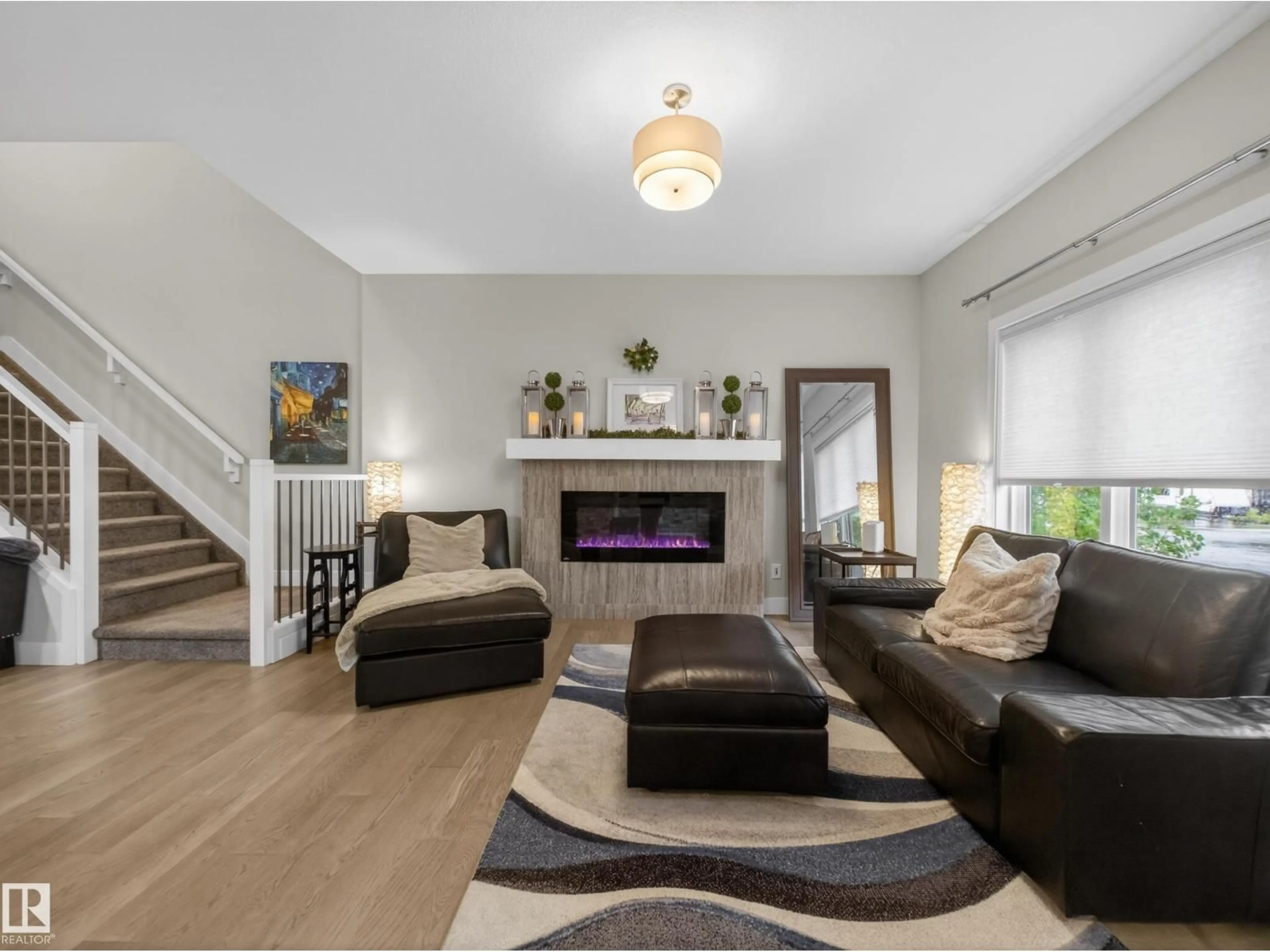 Living room with furniture, wood/laminate floor for 17 AMESBURY WD, Sherwood Park Alberta T8B0B5