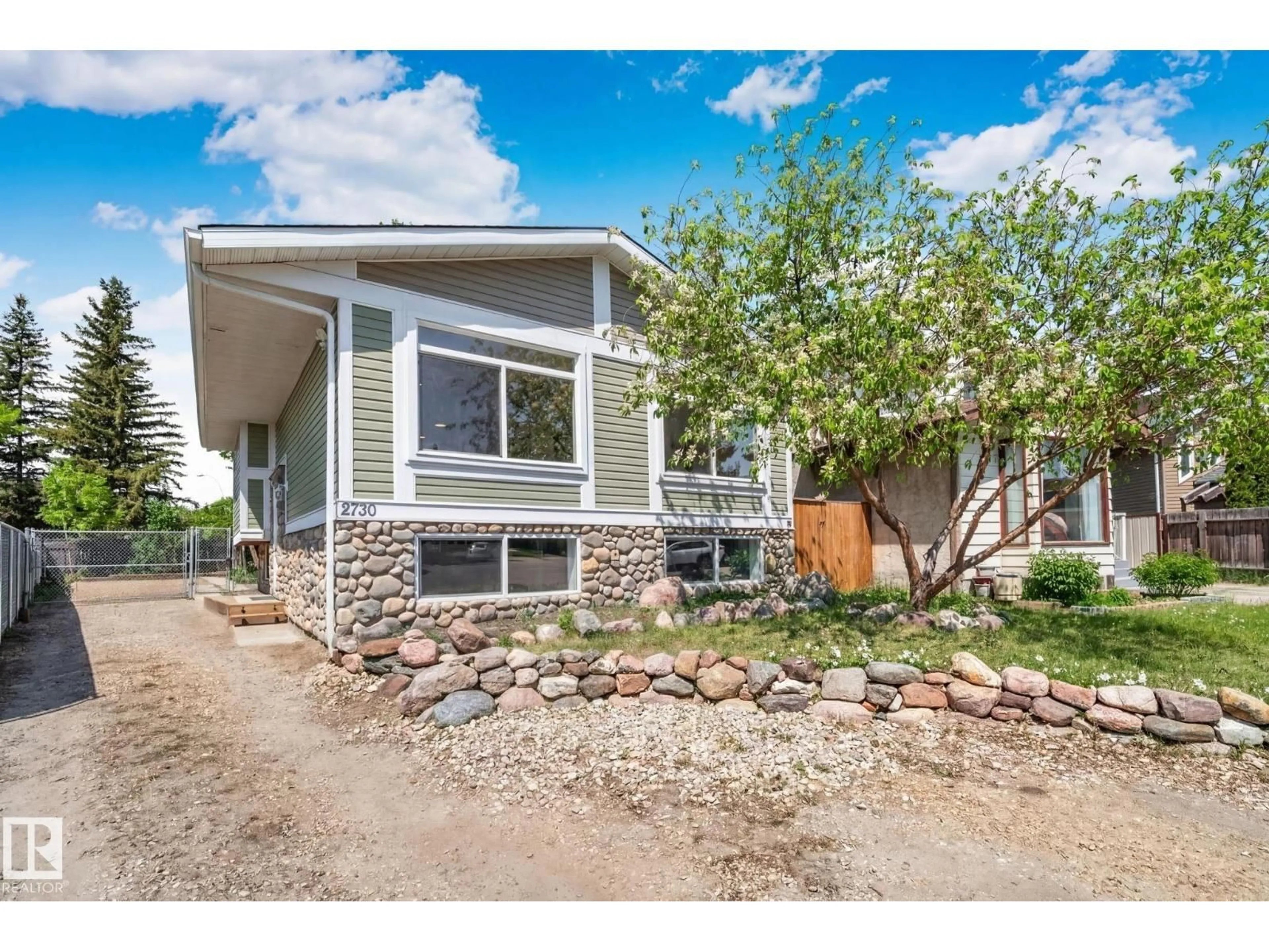 Home with vinyl exterior material, street for 2730 138A AV, Edmonton Alberta T5Y1A8
