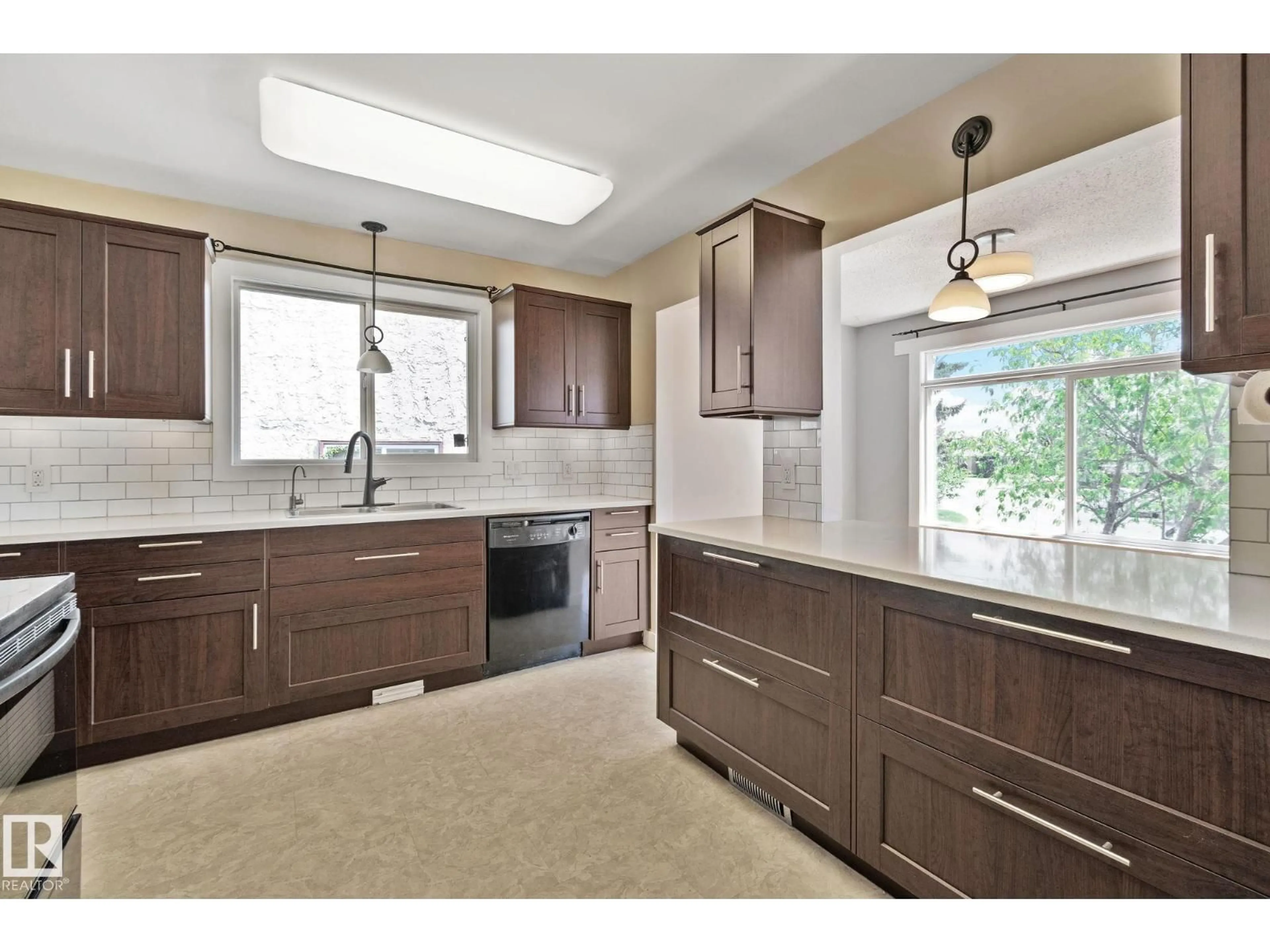 Open concept kitchen, ceramic/tile floor for 2730 138A AV, Edmonton Alberta T5Y1A8