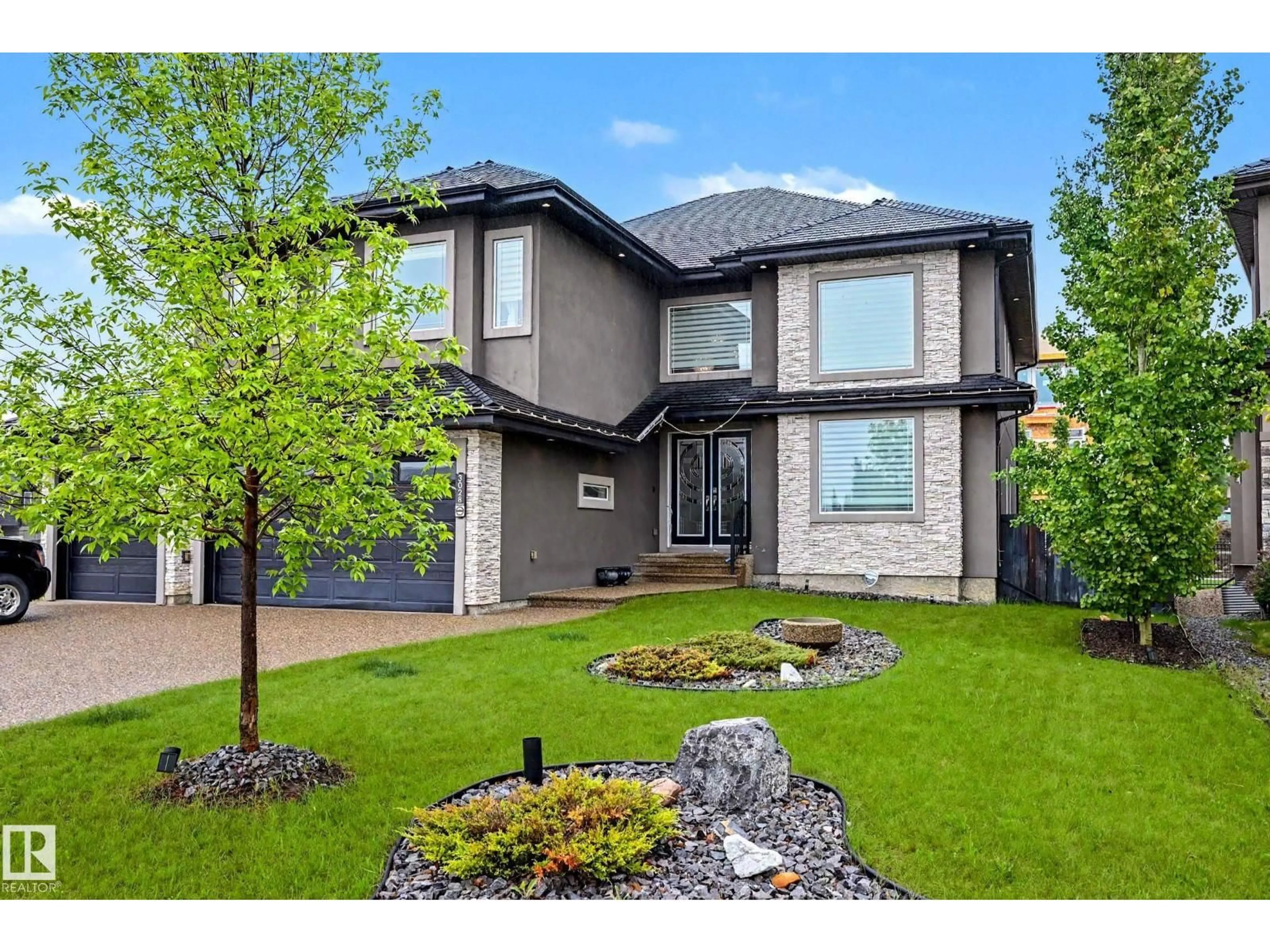 Home with brick exterior material, street for 3028 59 AV, Rural Leduc County Alberta T4X0X9