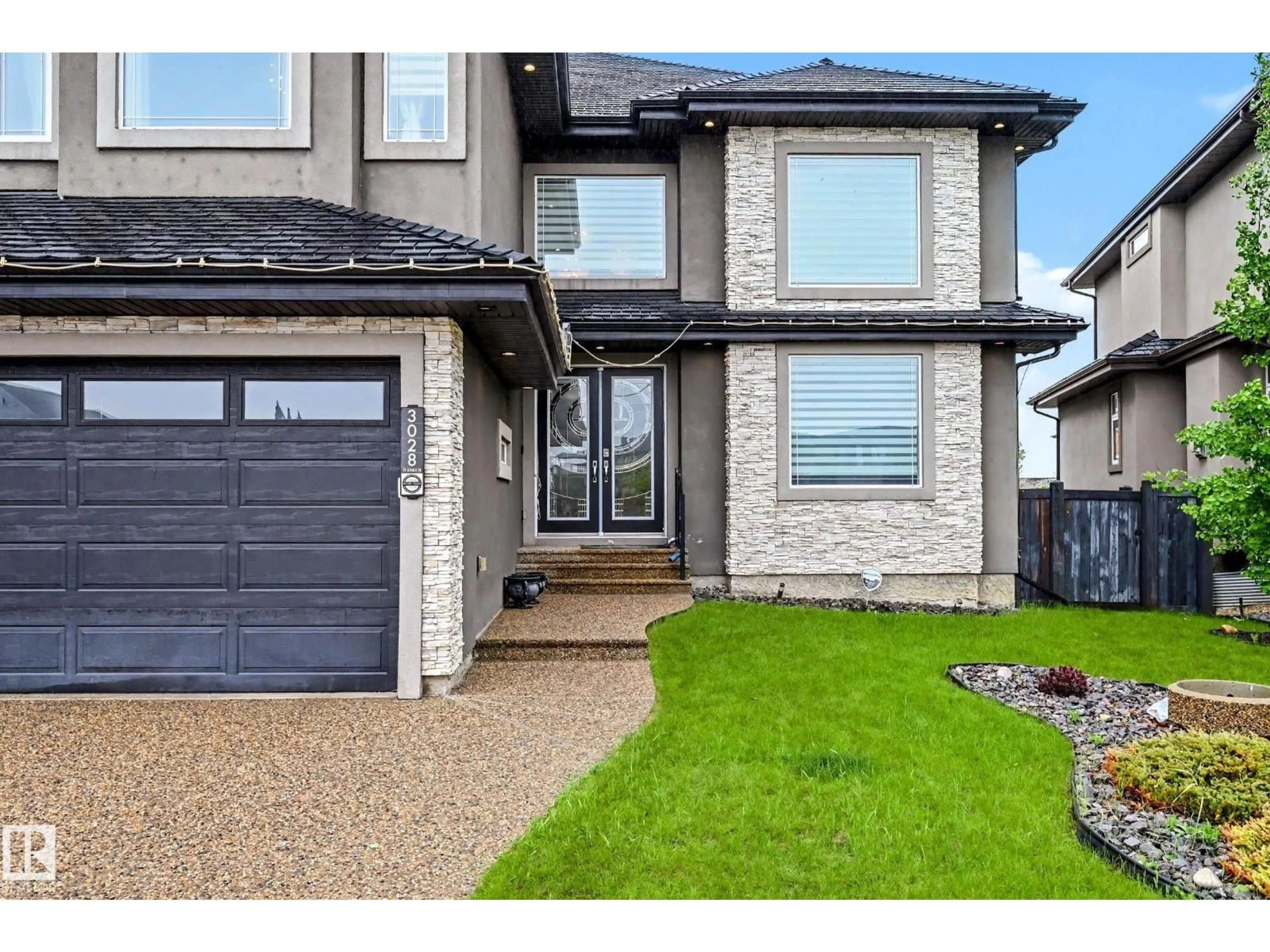 Home with brick exterior material, street for 3028 59 AV, Rural Leduc County Alberta T4X0X9