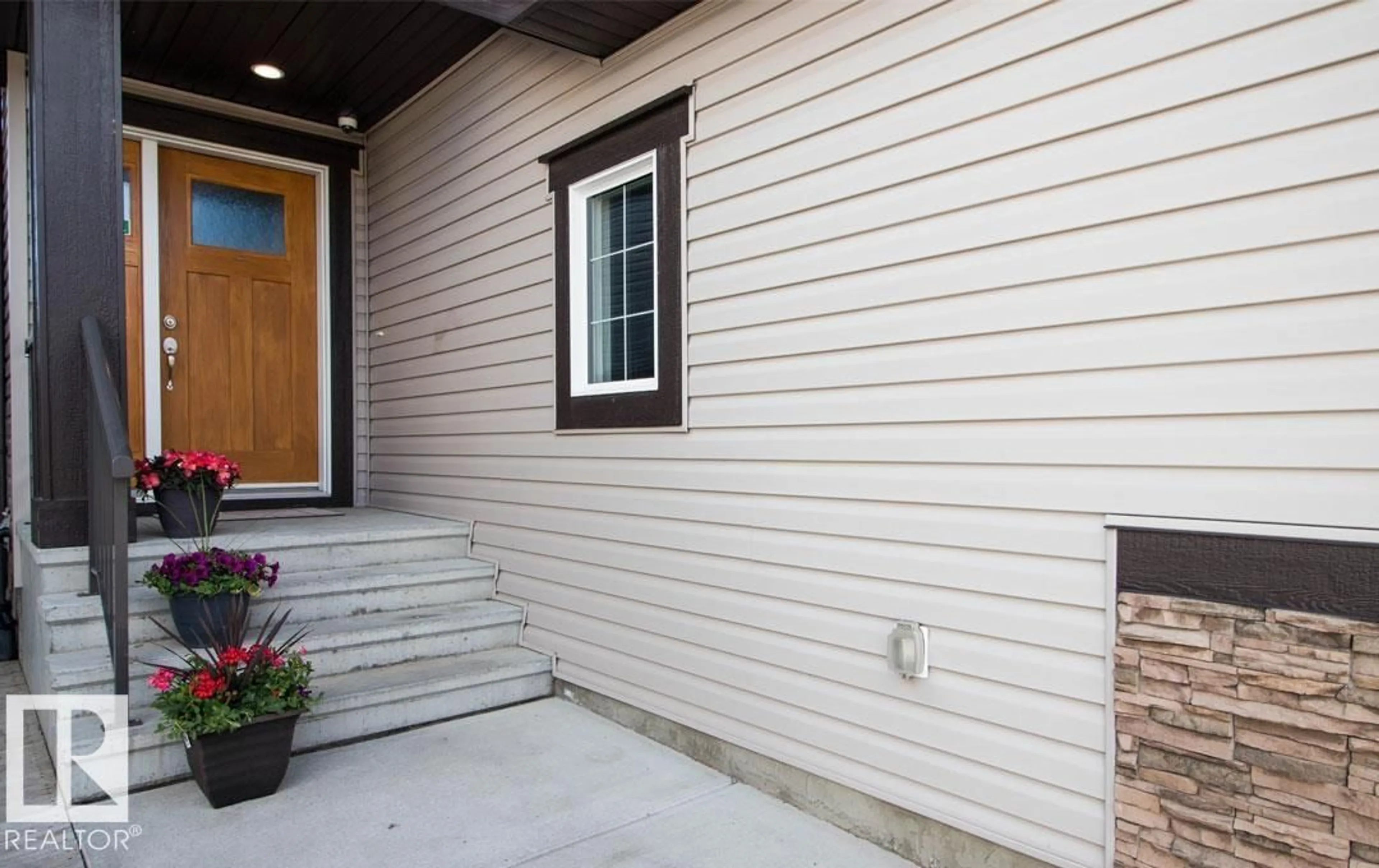 Home with vinyl exterior material, street for 13855 143 AV, Edmonton Alberta T6V0L7
