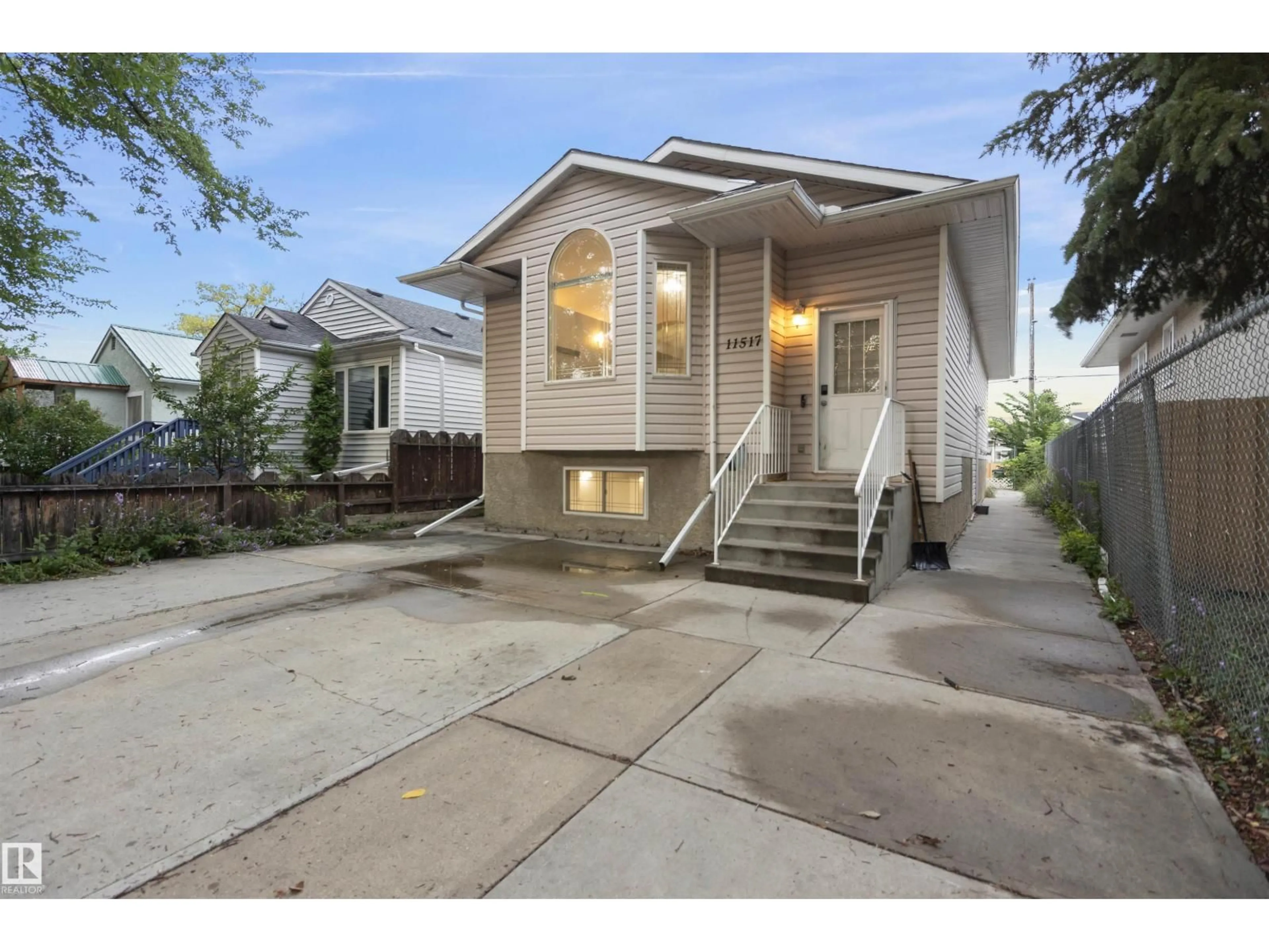 Home with vinyl exterior material, street for 11517 83 ST, Edmonton Alberta T5B2Y6