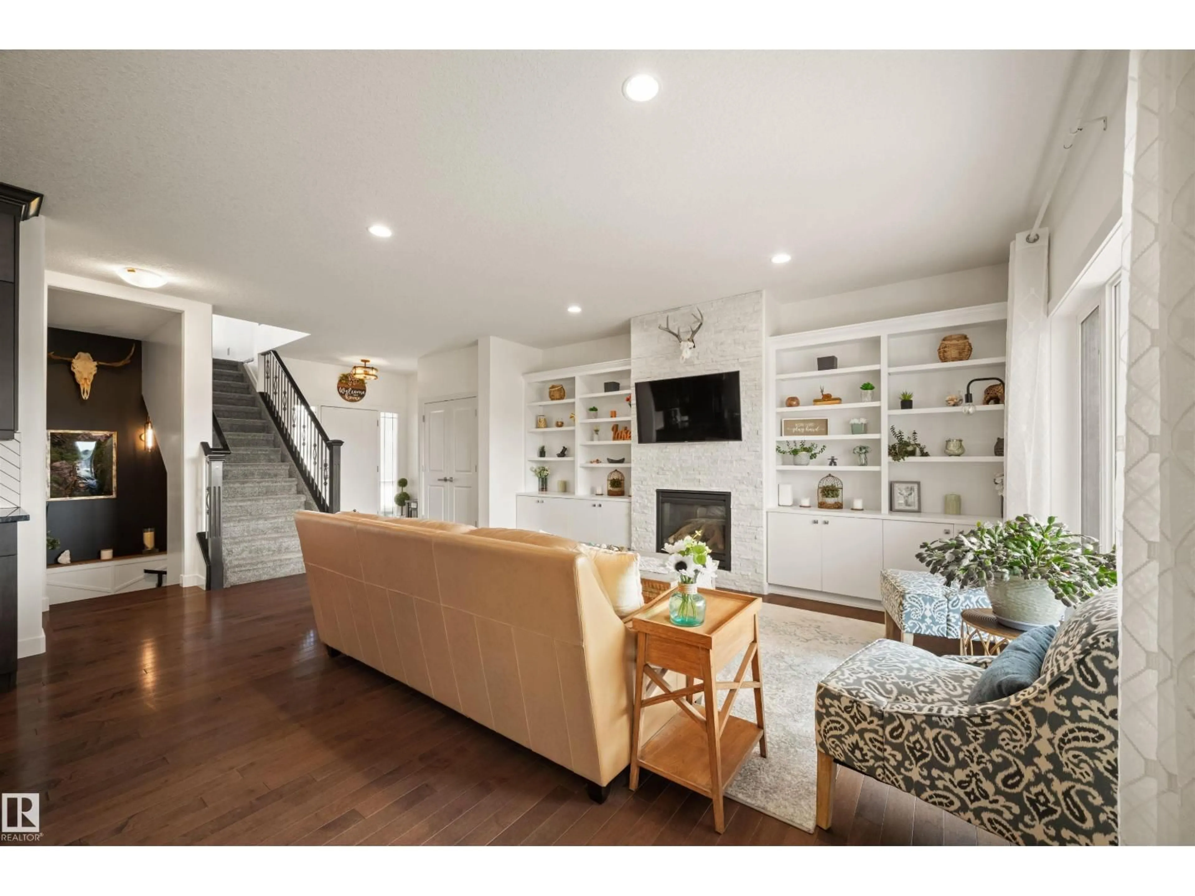 Living room with furniture, wood/laminate floor for 9629 106 AV, Morinville Alberta T8R0E8