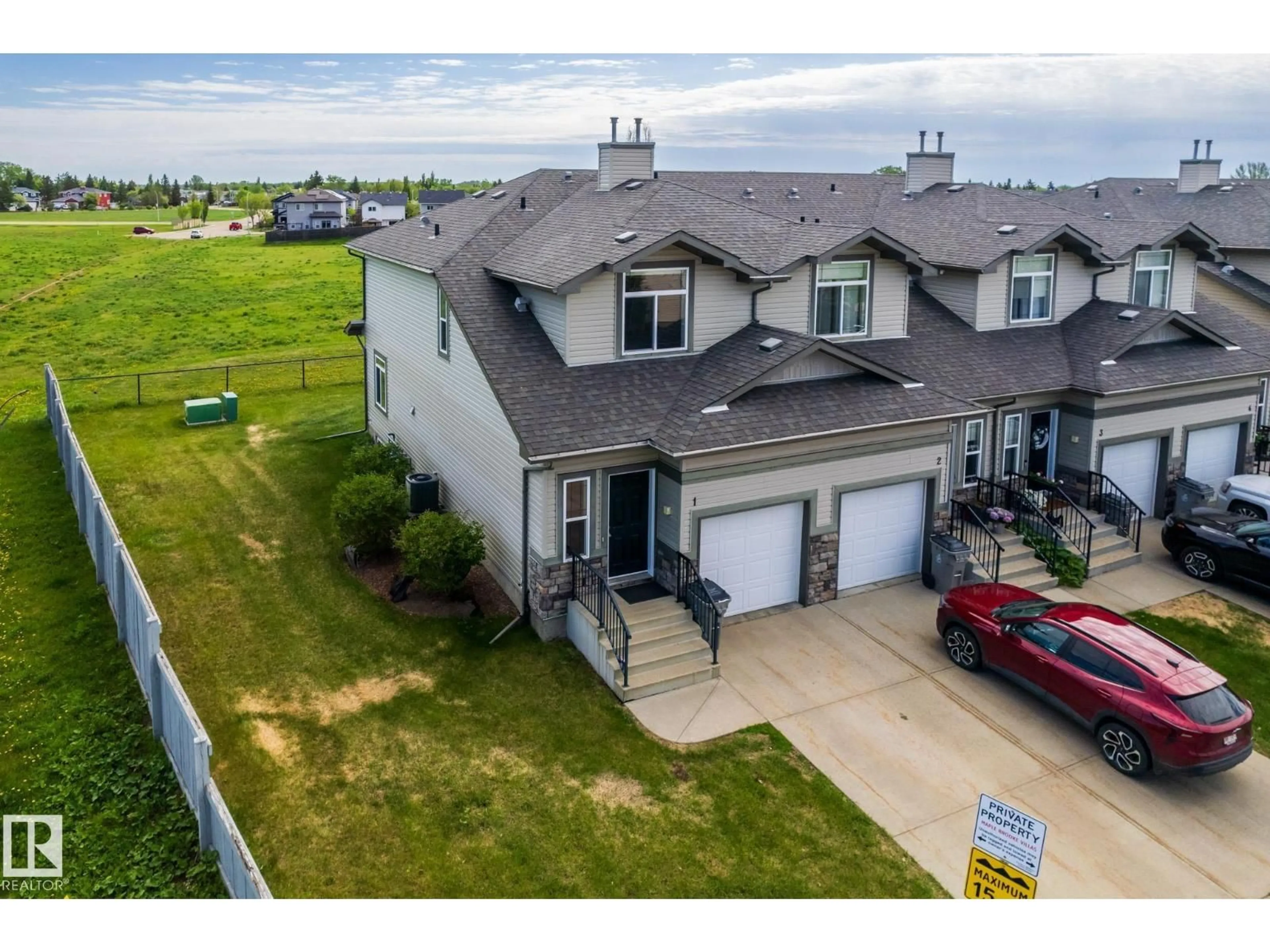 A pic from outside/outdoor area/front of a property/back of a property/a pic from drone, unknown for 9511 102 AV, Morinville Alberta T8R0C6