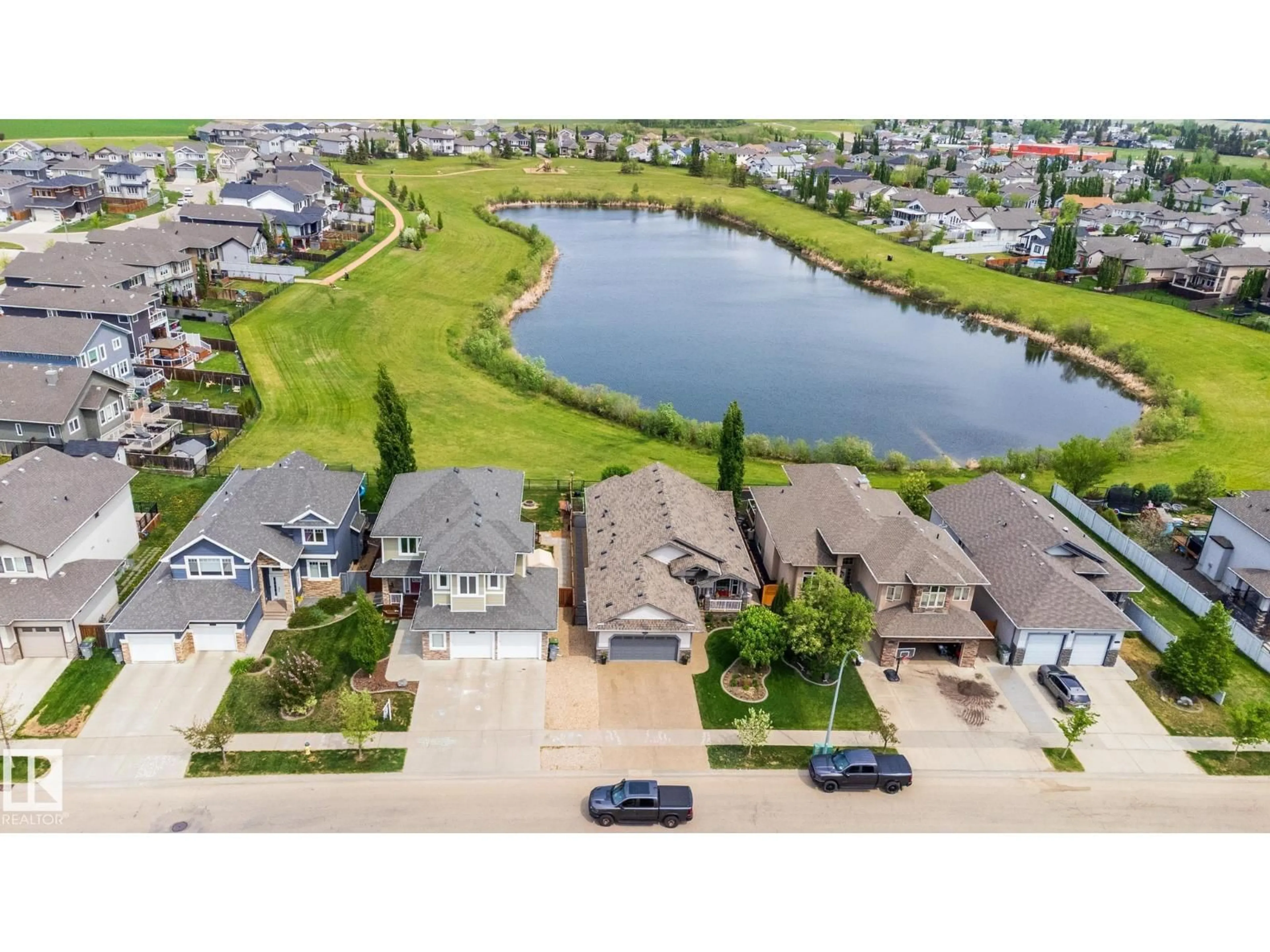 A pic from outside/outdoor area/front of a property/back of a property/a pic from drone, water/lake/river/ocean view for 10415 97 ST, Morinville Alberta T8R0B8
