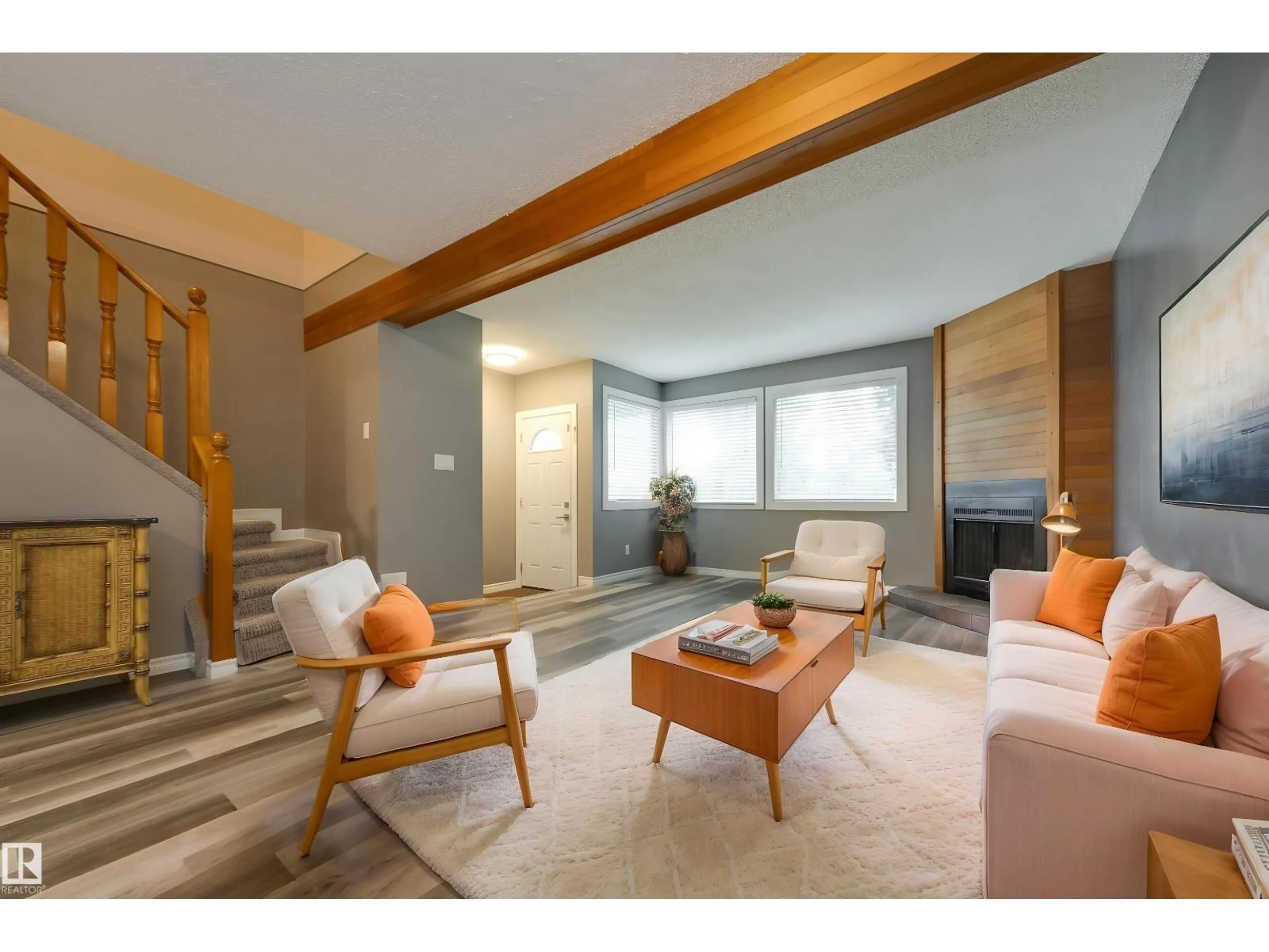 Living room with furniture, wood/laminate floor for 3526 42 AV, Edmonton Alberta T6L5C8