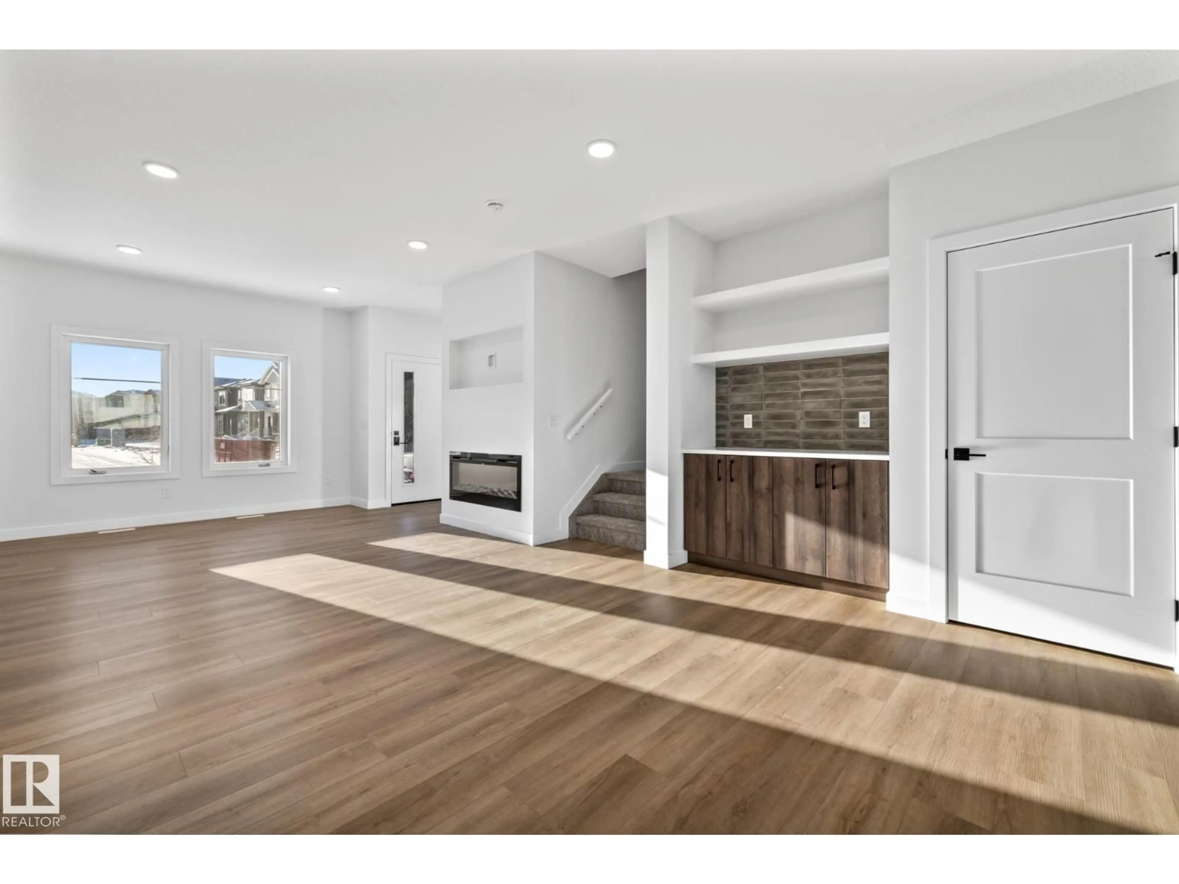 Open concept kitchen, wood/laminate floor for 206 STARLING, Fort Saskatchewan Alberta T8L0X9