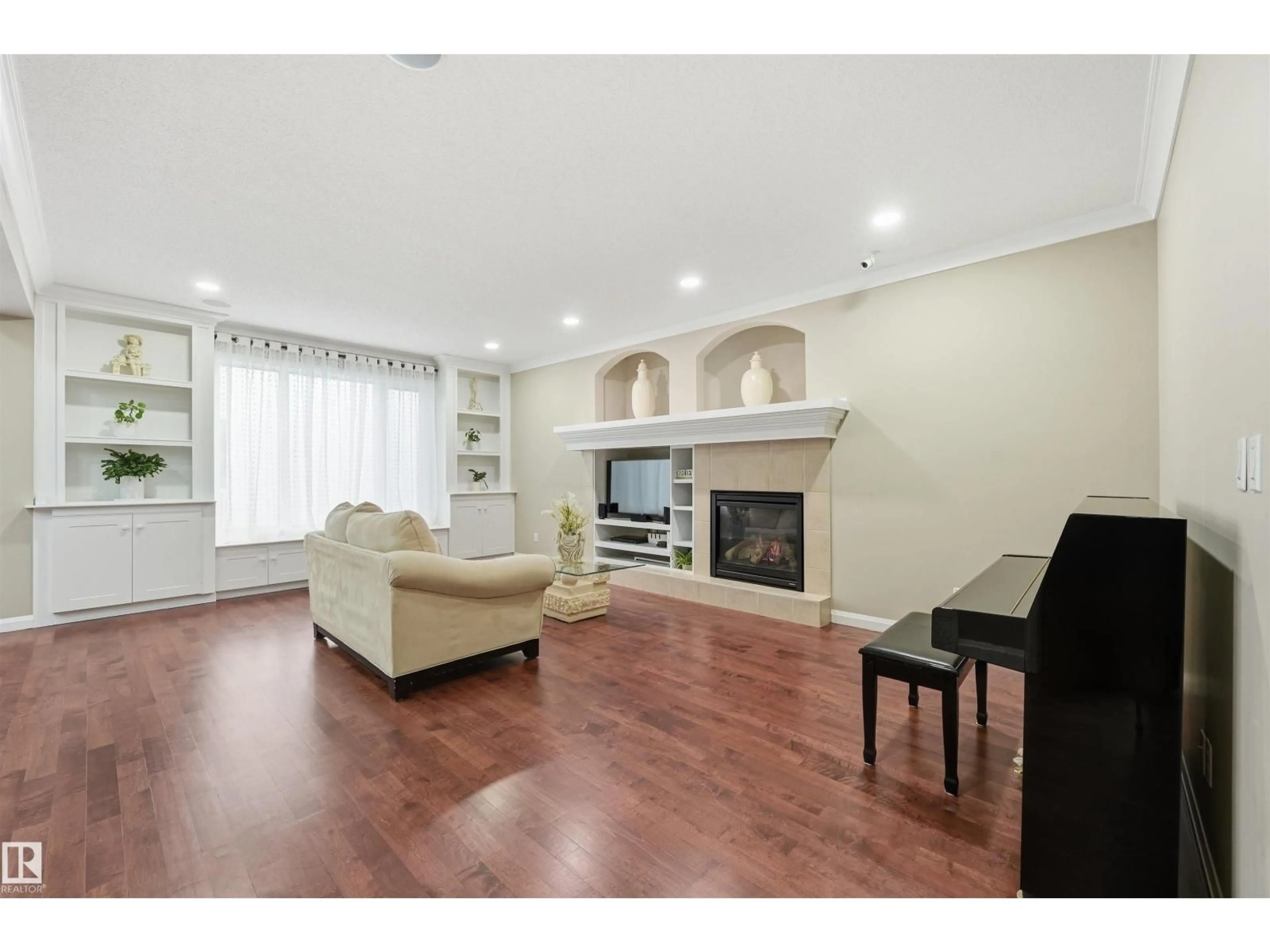 Living room with furniture, wood/laminate floor for 478 AINSLIE CR, Edmonton Alberta T6W0H7