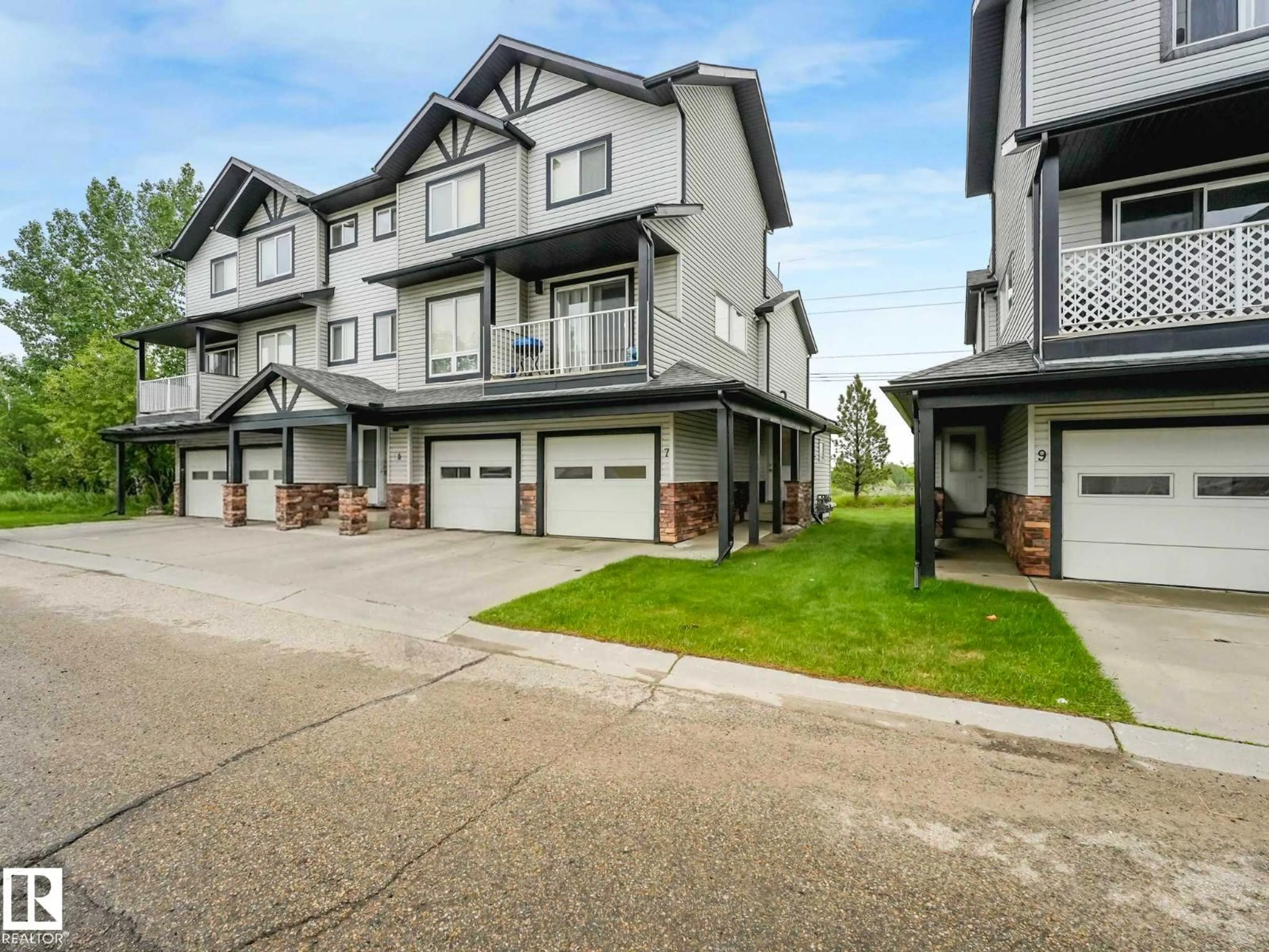 A pic from outside/outdoor area/front of a property/back of a property/a pic from drone, street for 11 - 7 CLOVER BAR LN, Sherwood Park Alberta T8H0C4