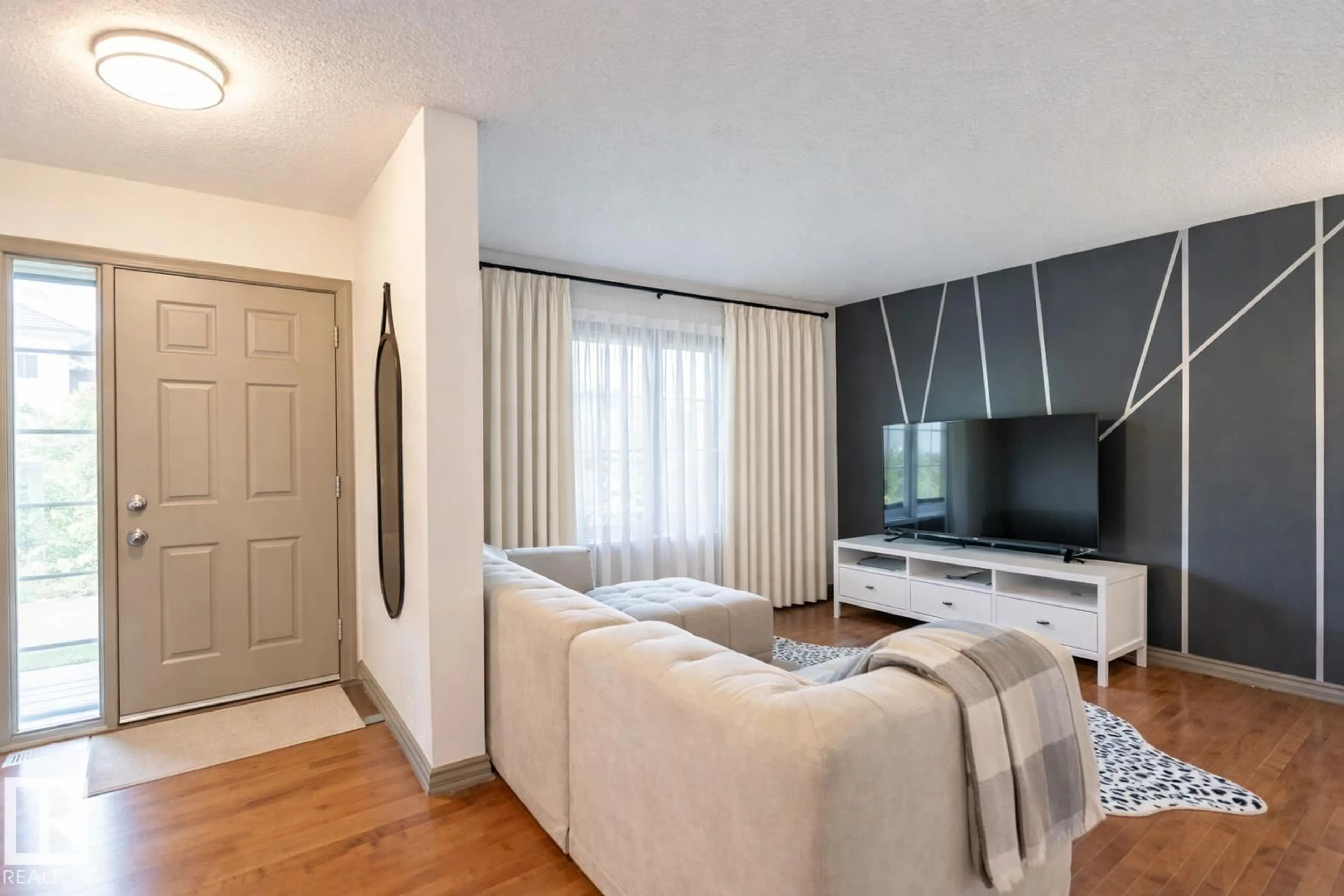 Living room with furniture, wood/laminate floor for 60 KEYSTONE CR, Leduc Alberta T9E0M5