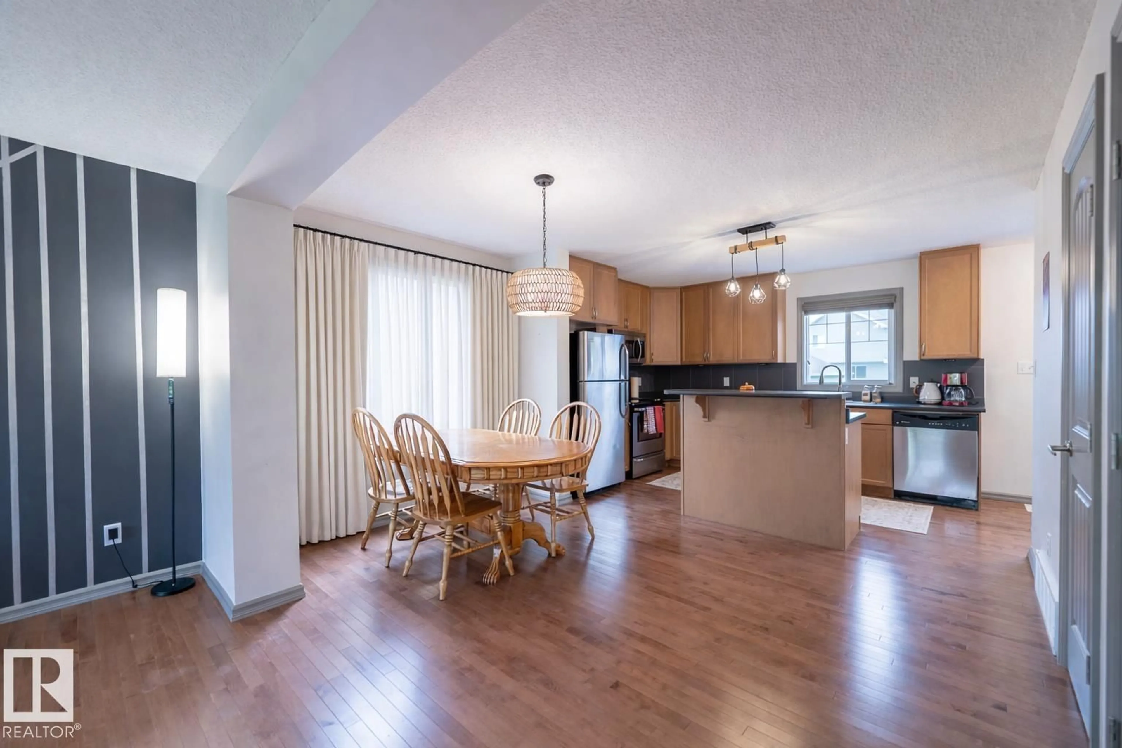 Open concept kitchen, wood/laminate floor for 60 KEYSTONE CR, Leduc Alberta T9E0M5