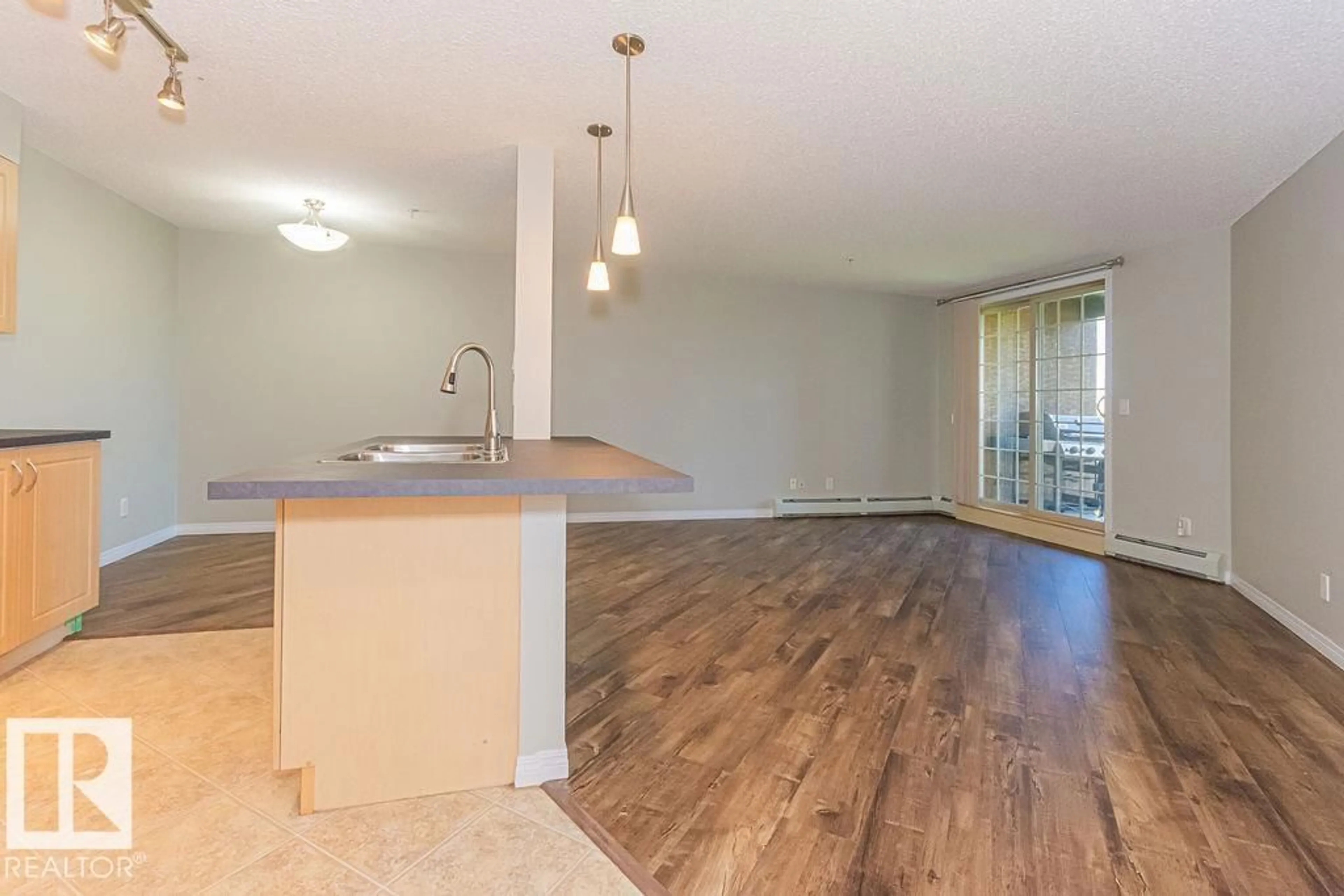 Open concept kitchen, wood/laminate floor for #311 - 11453 ELLERSLIE RD, Edmonton Alberta T6W1T3