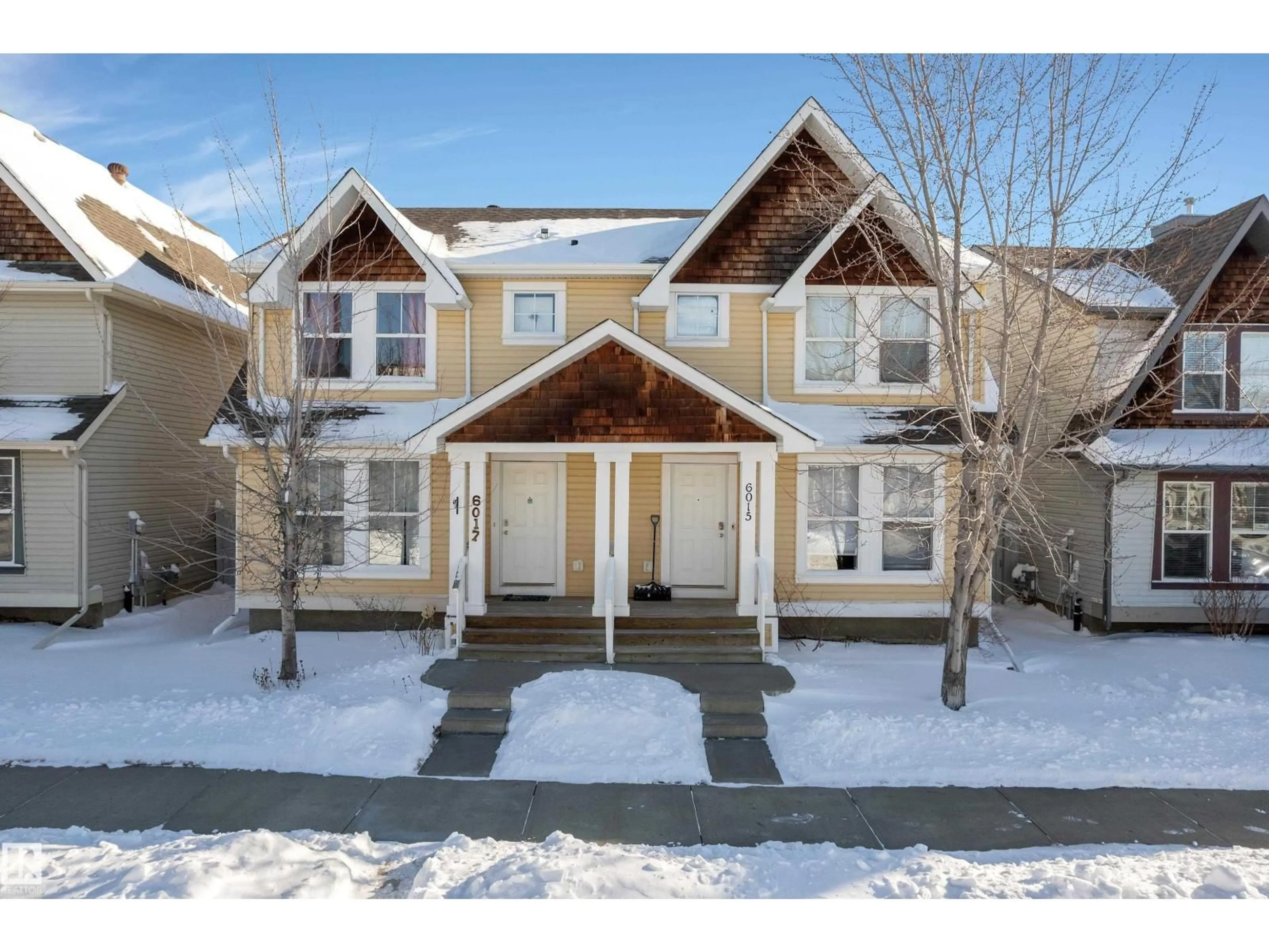 Home with vinyl exterior material, street for NW - 6017 213 ST, Edmonton Alberta T6M0H7