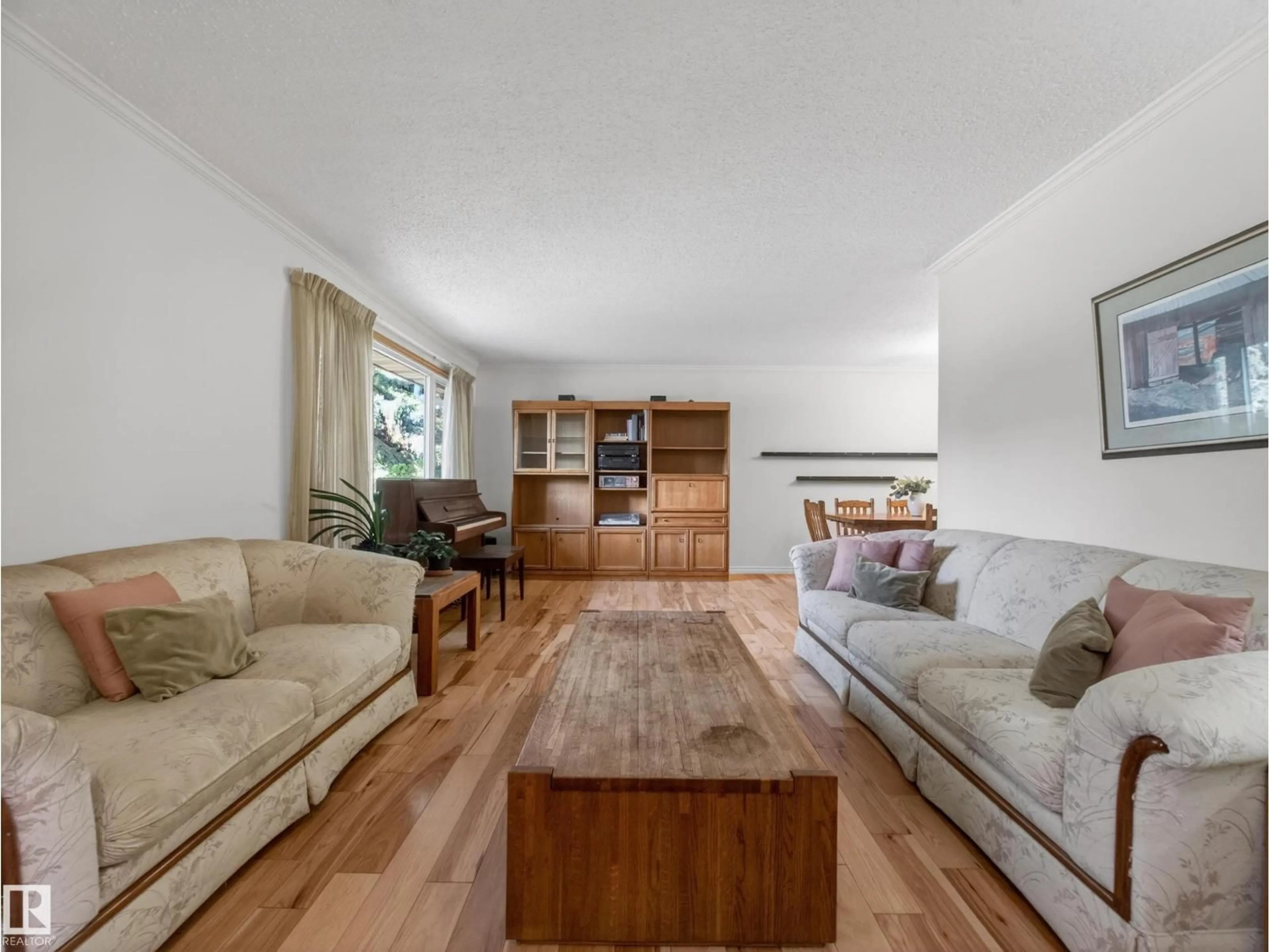 Living room with furniture, wood/laminate floor for NW - 18416 90 AV, Edmonton Alberta T5T1N7