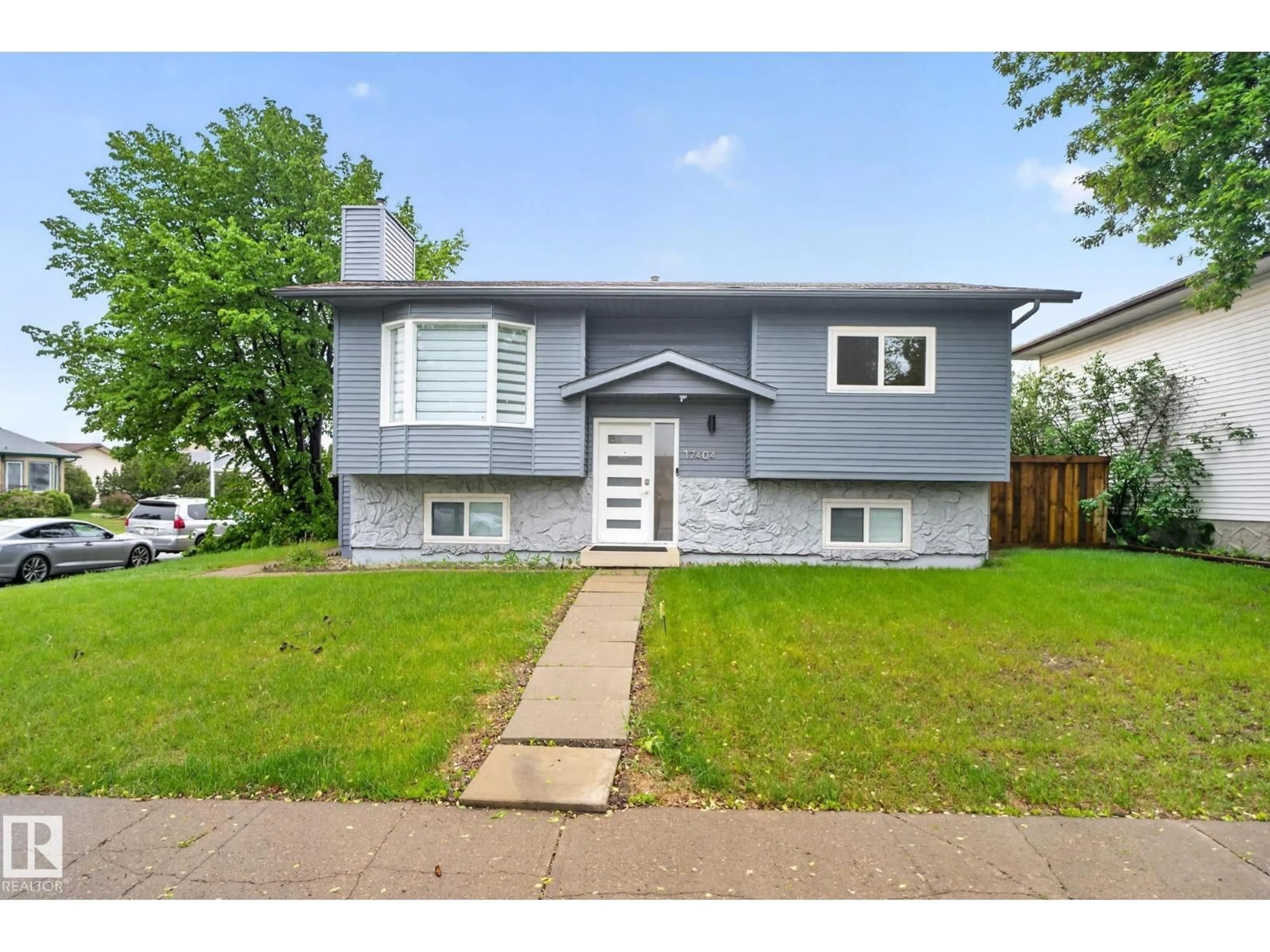 Home with vinyl exterior material, street for 17404 95 ST, Edmonton Alberta T5Z2B9