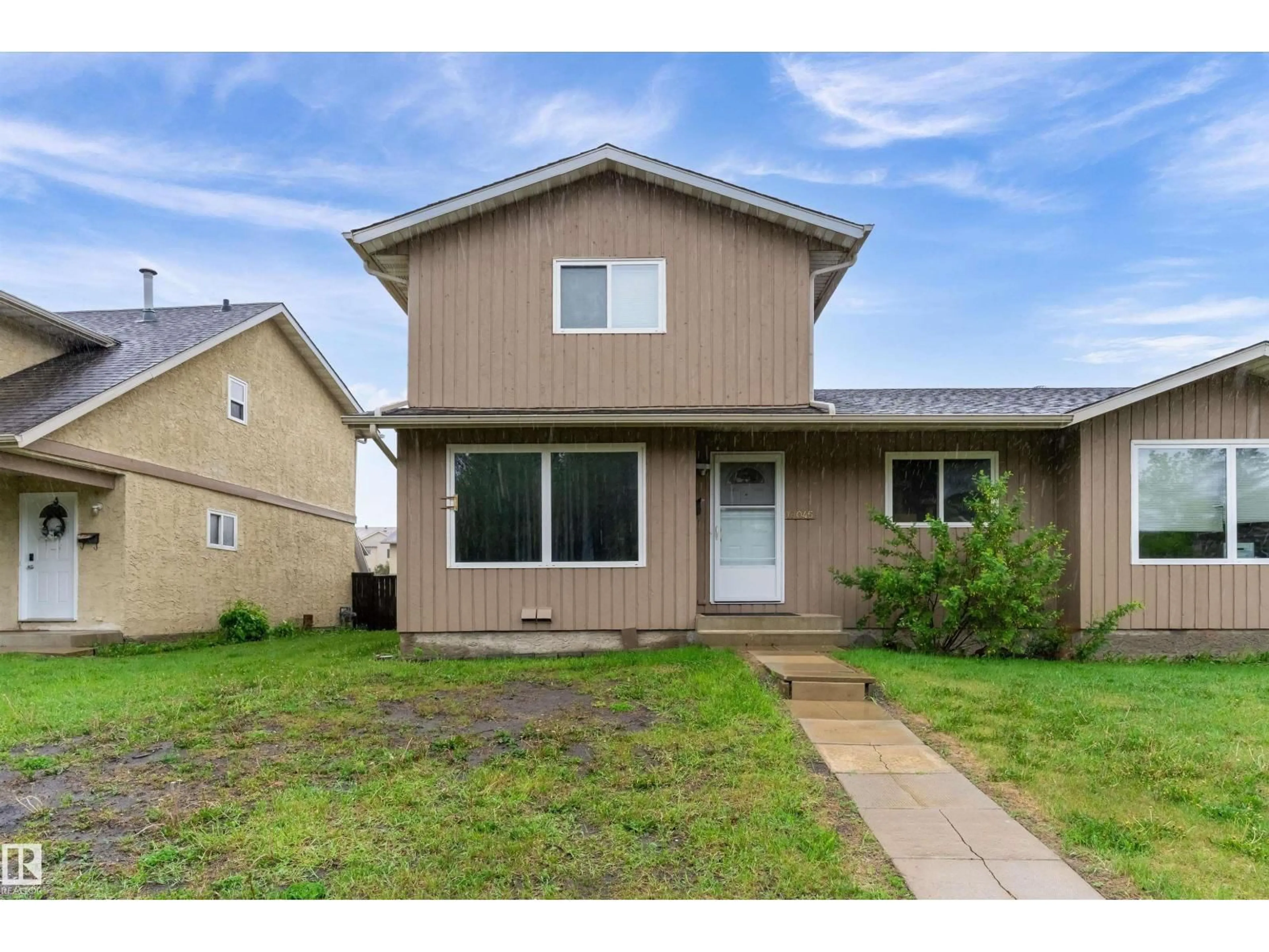 Home with vinyl exterior material, street for 18045 96 AV, Edmonton Alberta T5T2Z3