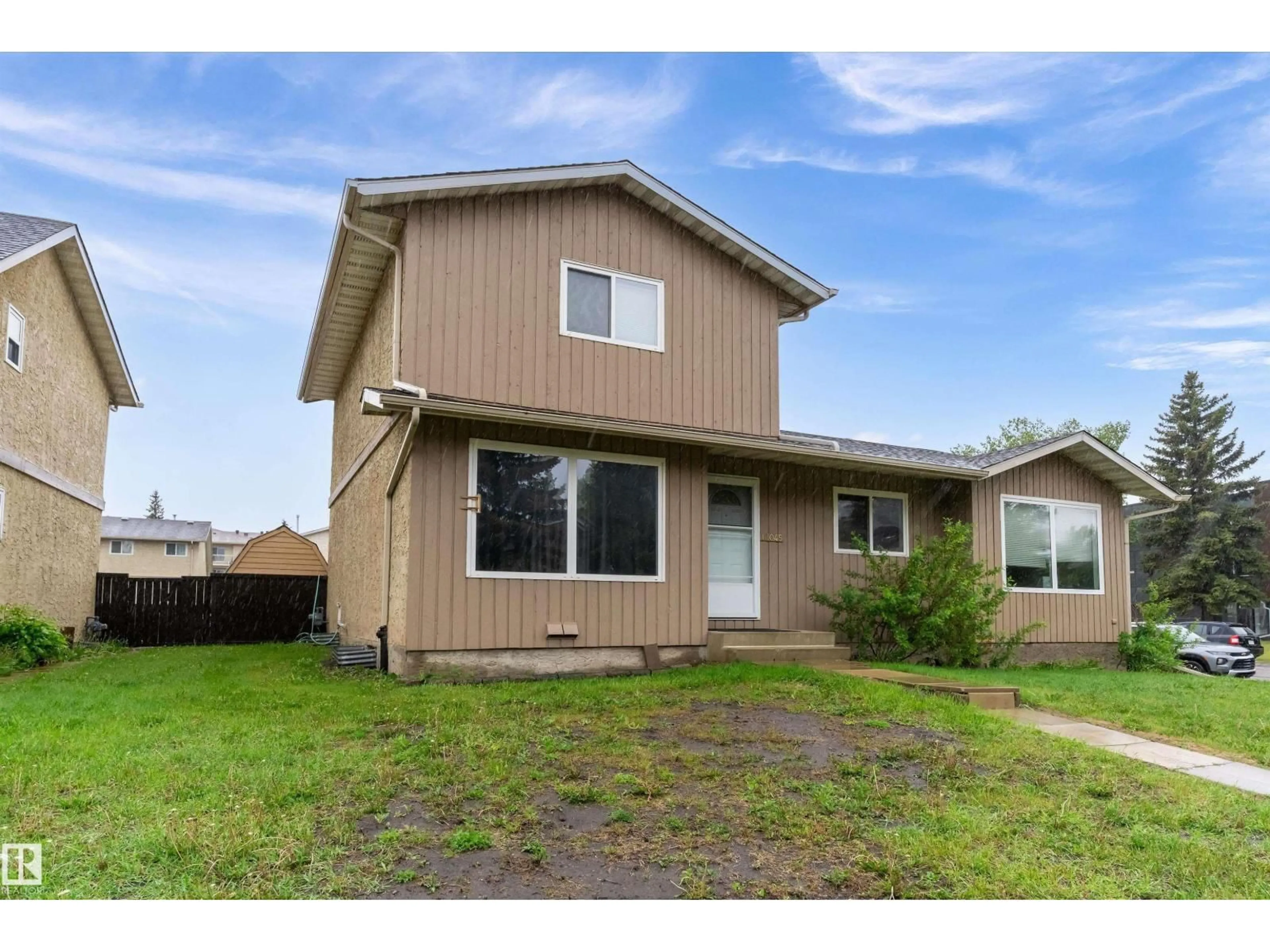 Home with vinyl exterior material, street for 18045 96 AV, Edmonton Alberta T5T2Z3