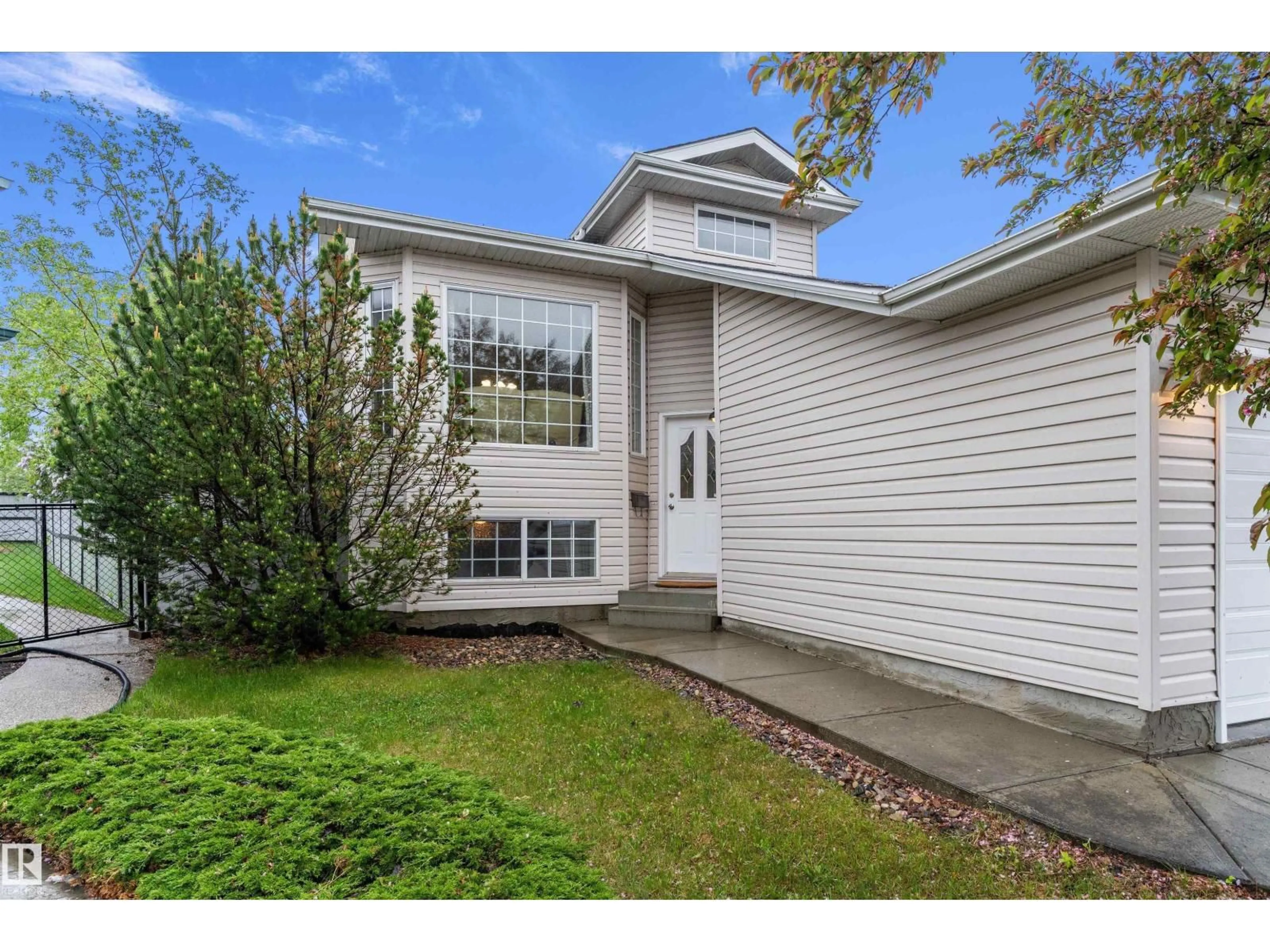 Home with vinyl exterior material, street for 12811 161 AV, Edmonton Alberta T6V1M8